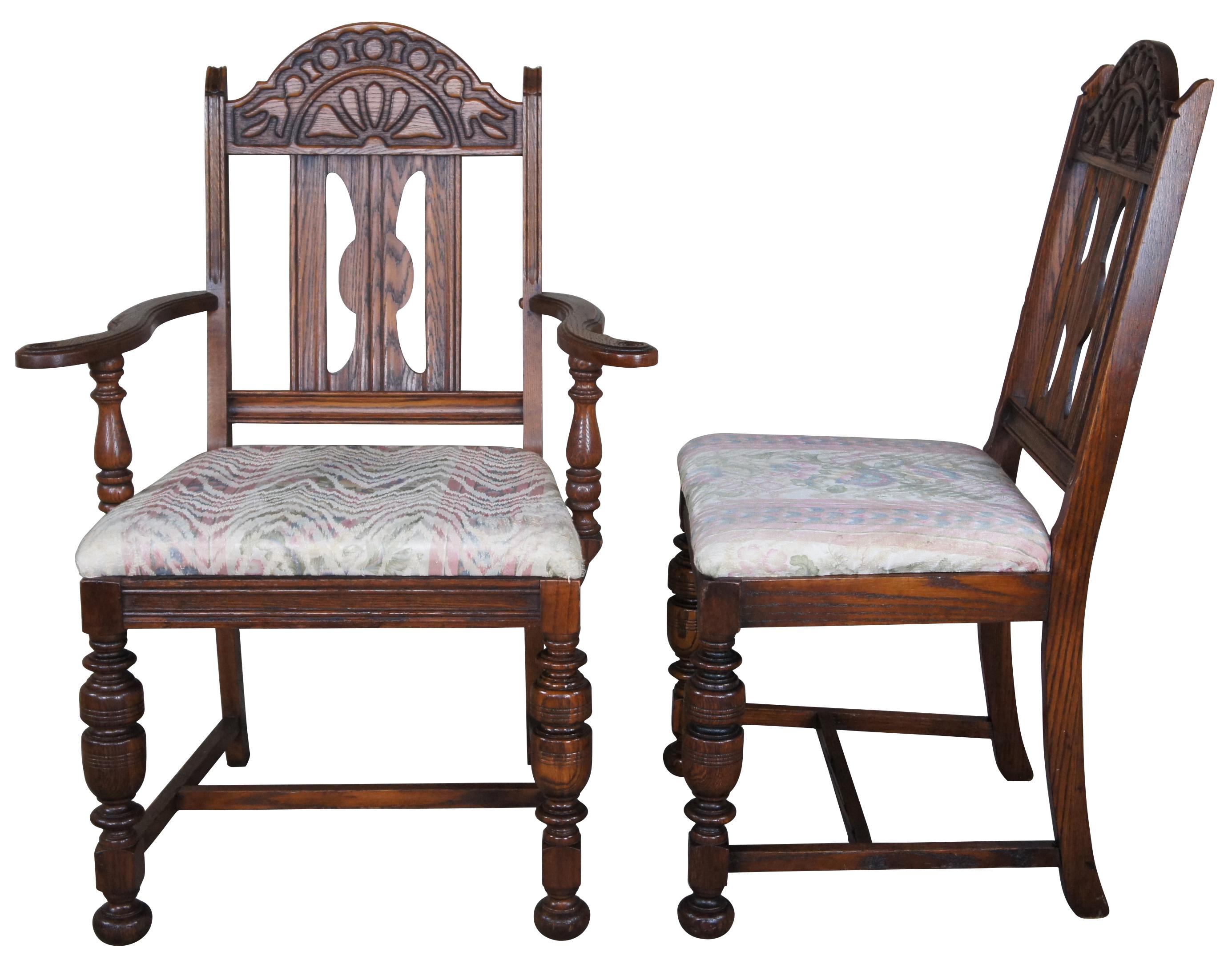A beautiful set of 6 early 20th century Jacobean dining chairs. Features a serpentine carved crest rail over pierced splat flanked by fluted stiles. Each chair is supported by robust turned baluster legs with bun feet along the front and saber legs