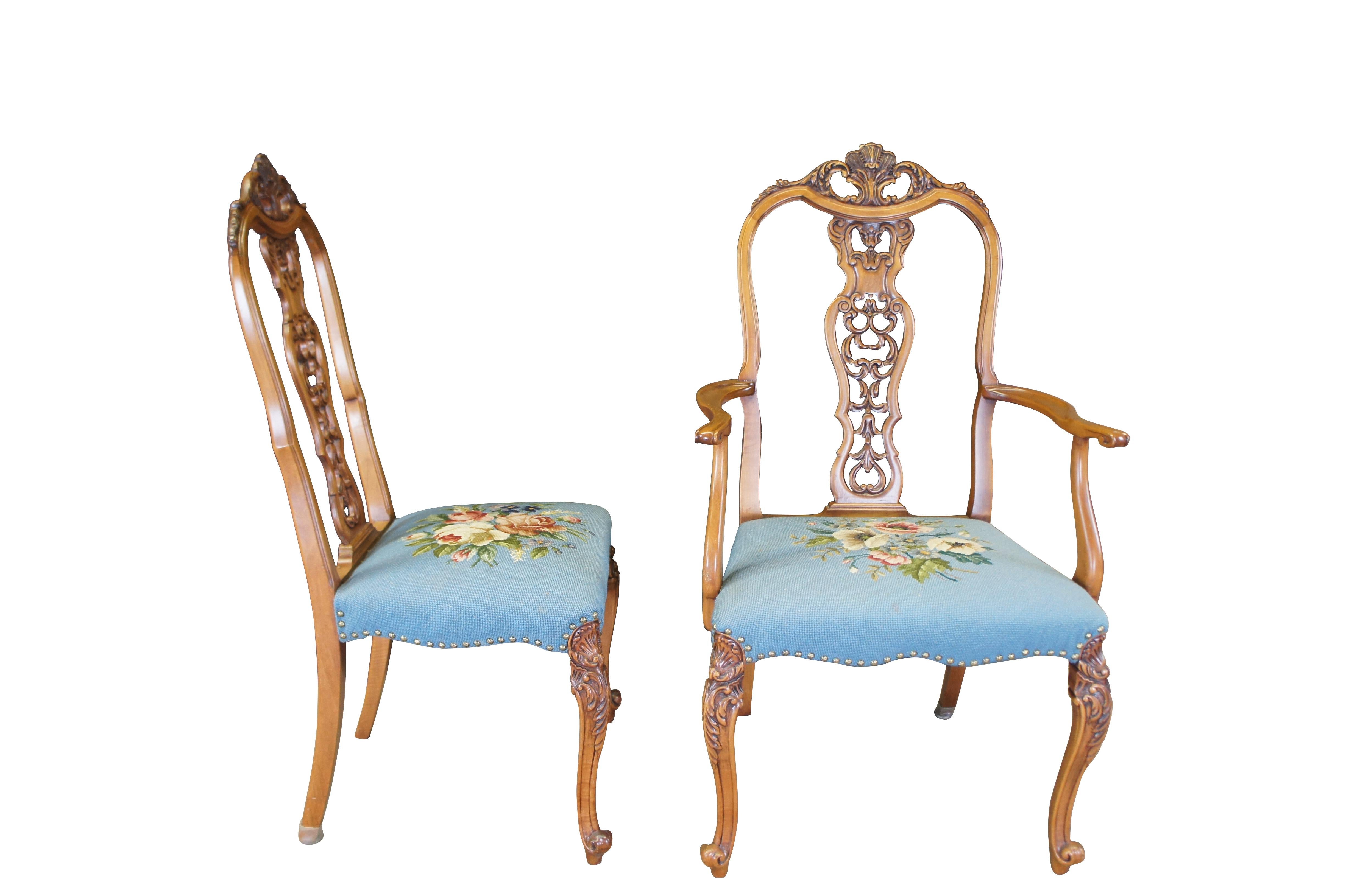 Antique French Provincial Louis XV dining armchair and side chairs.  Made of walnut featuring a baroque serpentine acanthus design with pierced reticulated slat and needlepoint seats with nailhead trim.

Dimensions:
21