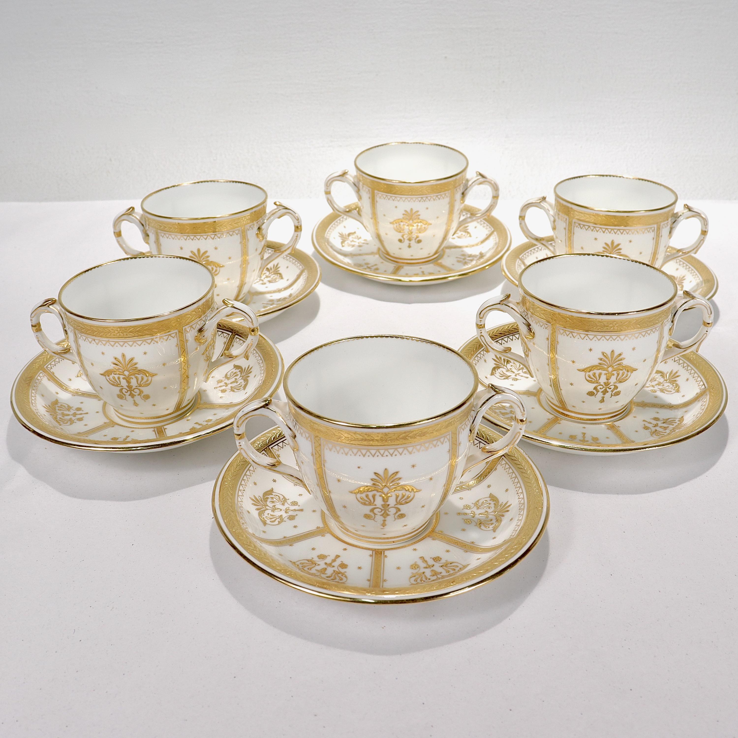 A fine set of 6 richly gilt porcelain bullion or tea cups.

By Mintons.

In an Aesthetic Movement numbered pattern with raised gold and gold jeweling throughout.

Each marked to the base with a puce maker's mark that reads 58013 / Manufactured for
