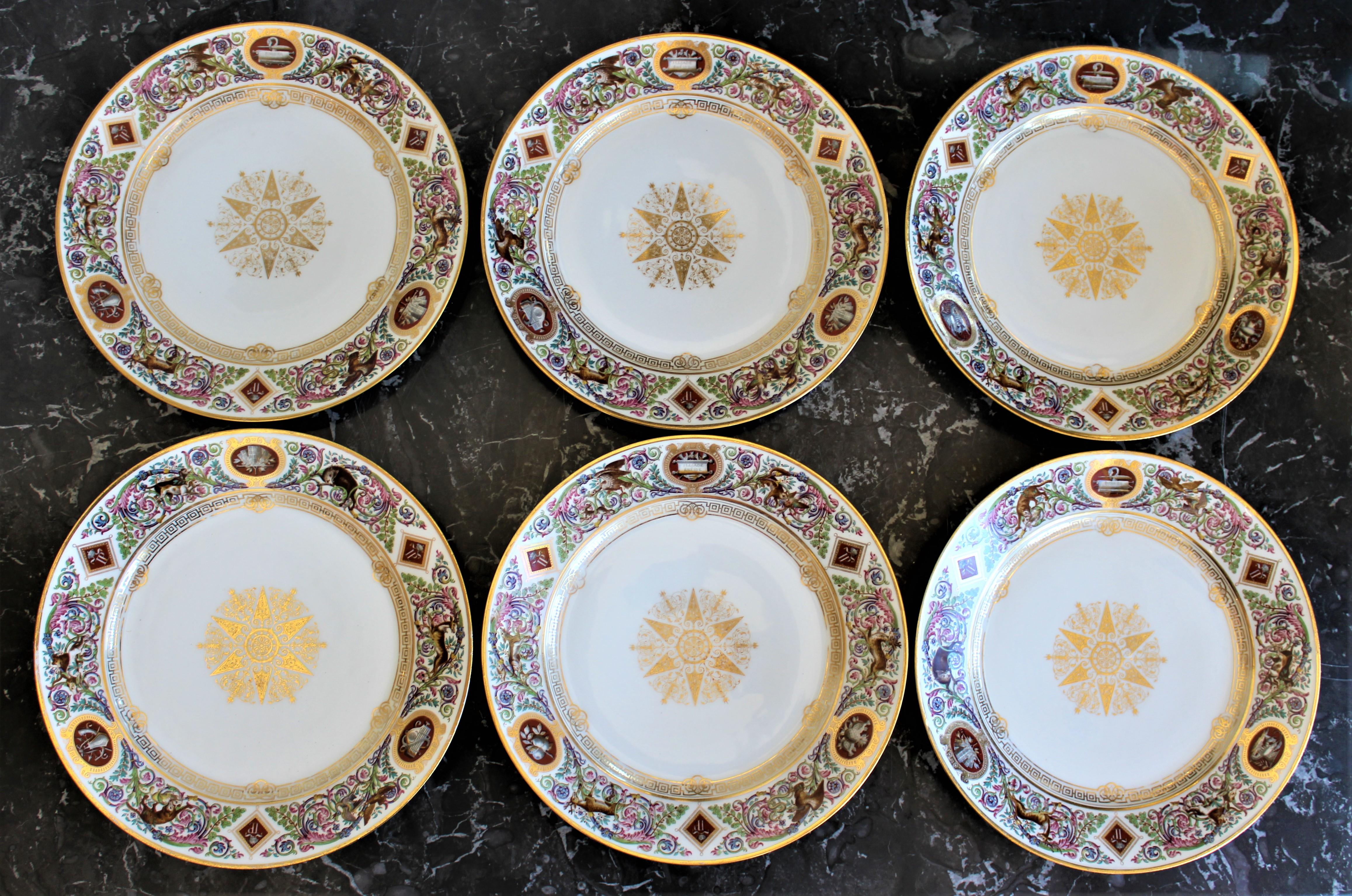 Dating from the mid-19th century and having their origins in France are a set of six signed Sevres Louis Philippe hunting at Chateau de Fountainbleu porcelain dinner or cabinet plates. The plates are done in a Neoclassical style depicting animals