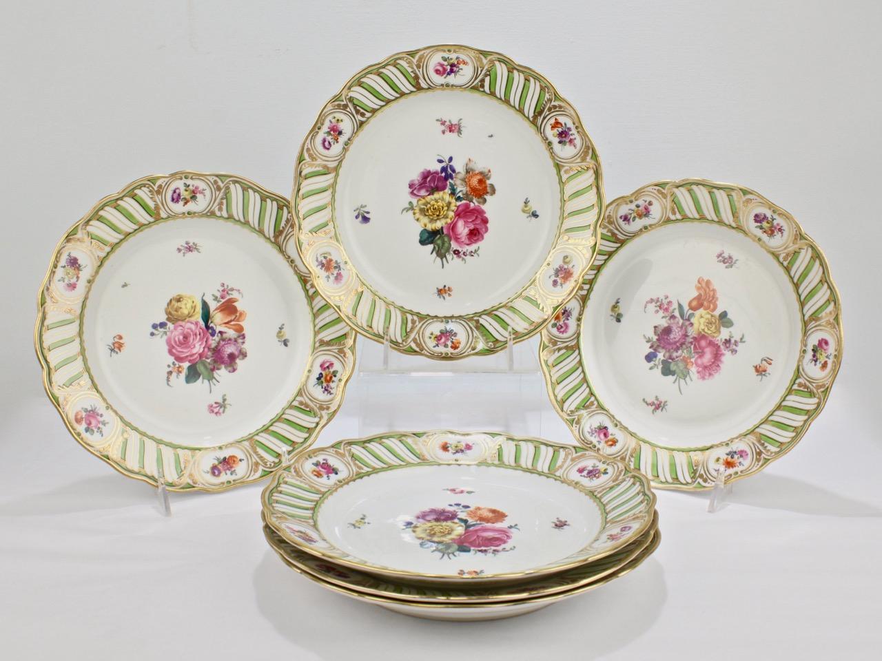 A sophisticated set of 6 antique Vienna porcelain plates.

Each having a green and white border with floral cartouches and finely painted Deutsche Blumen floral sprays to the centers.

Simply top shelf quality. Perfect for the table or