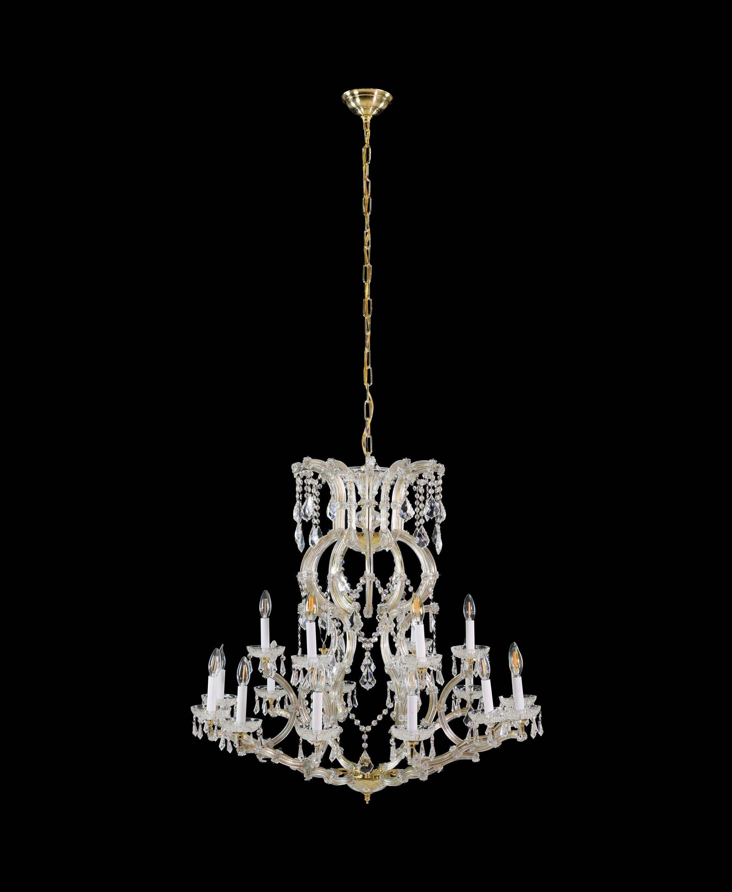 The elegant six arm eighteen lights Marie Therese crystal & brass chandelier exudes timeless beauty. With its intricate brass frame and sparkling crystal accents, it illuminates any space with a dazzling radiance. This exquisite chandelier is a