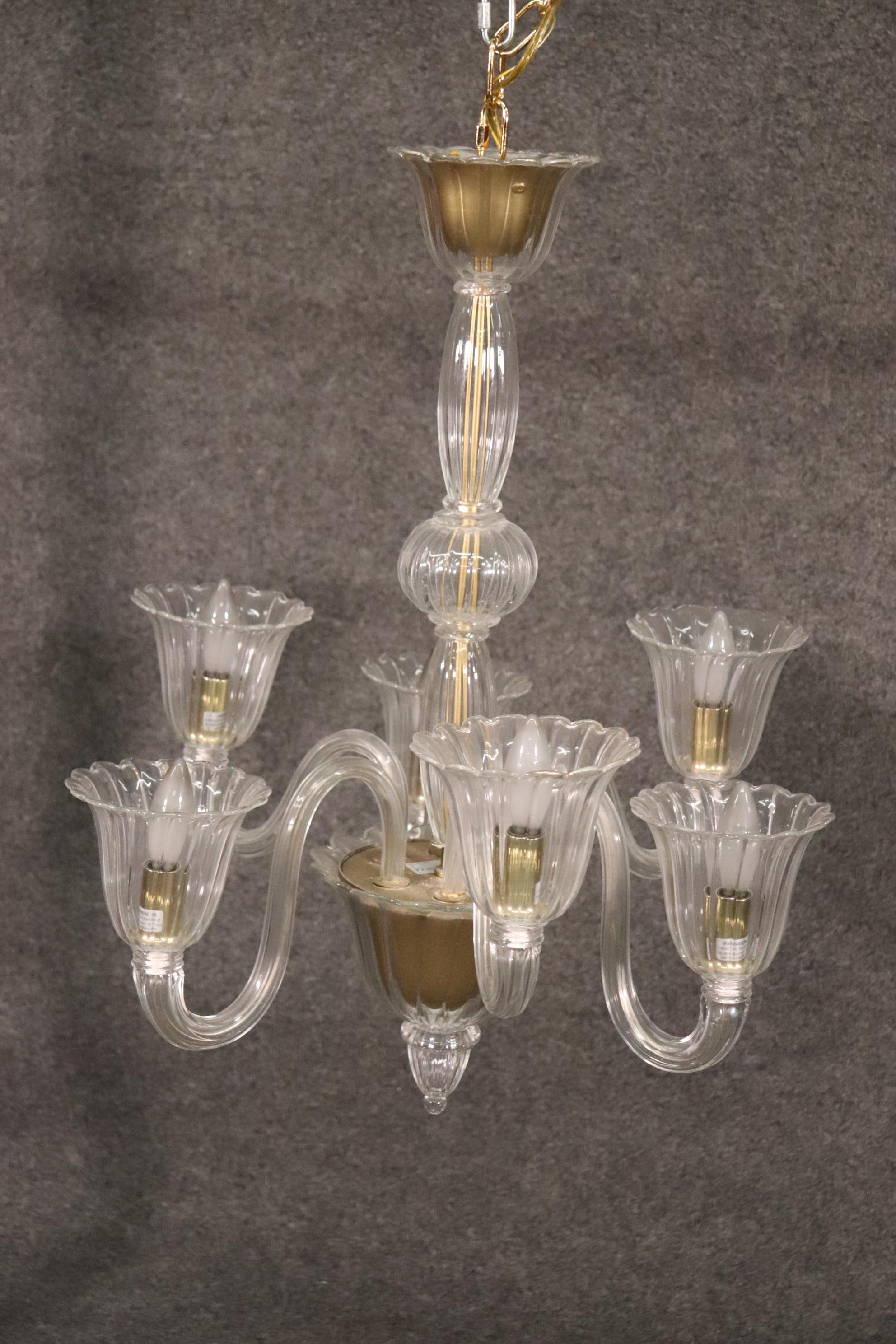 This is a beautiful 6-arm chandelier made in Italy of Murano glass. The chandelier measures 23 x 23 x 28 tall and will require rewiring since it is Italian. The chandelier dates to the 1950s.