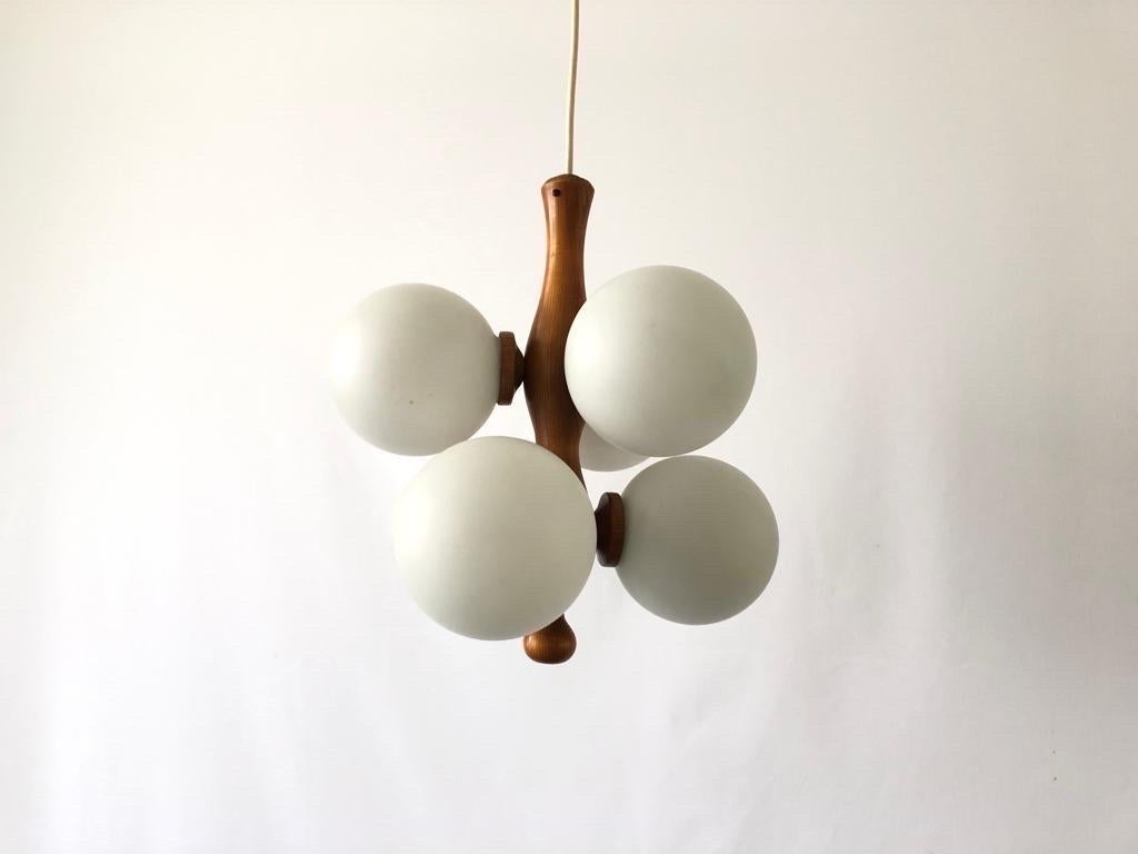 6 Armed Glass & Wood Body Sputnik Chandelier, 1970s, Germany

Lampshade is in good condition and very clean. 
This lamp works with 6 x E14 light bulb. 
Wired and suitable to use with 220V and 110V for all countries.

Measurements:
Height: 120