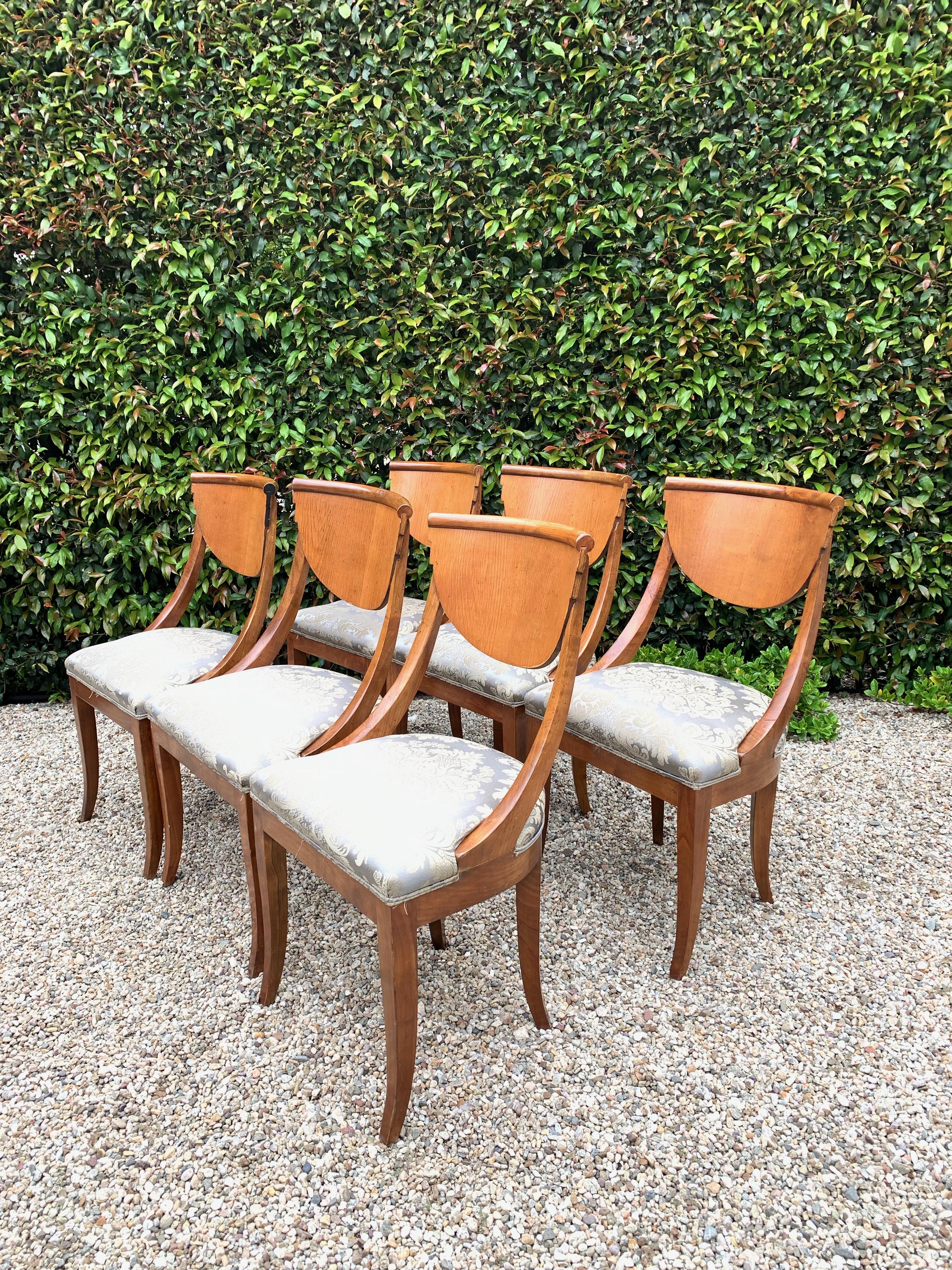 Set of six armless curved back (spoonback) dining chairs in the manner of Art Decor or Biedermeier Style. This handsome set are truly stunning and very comfortable! In the manner of early 19th century style, the Classic design is a compliment to any