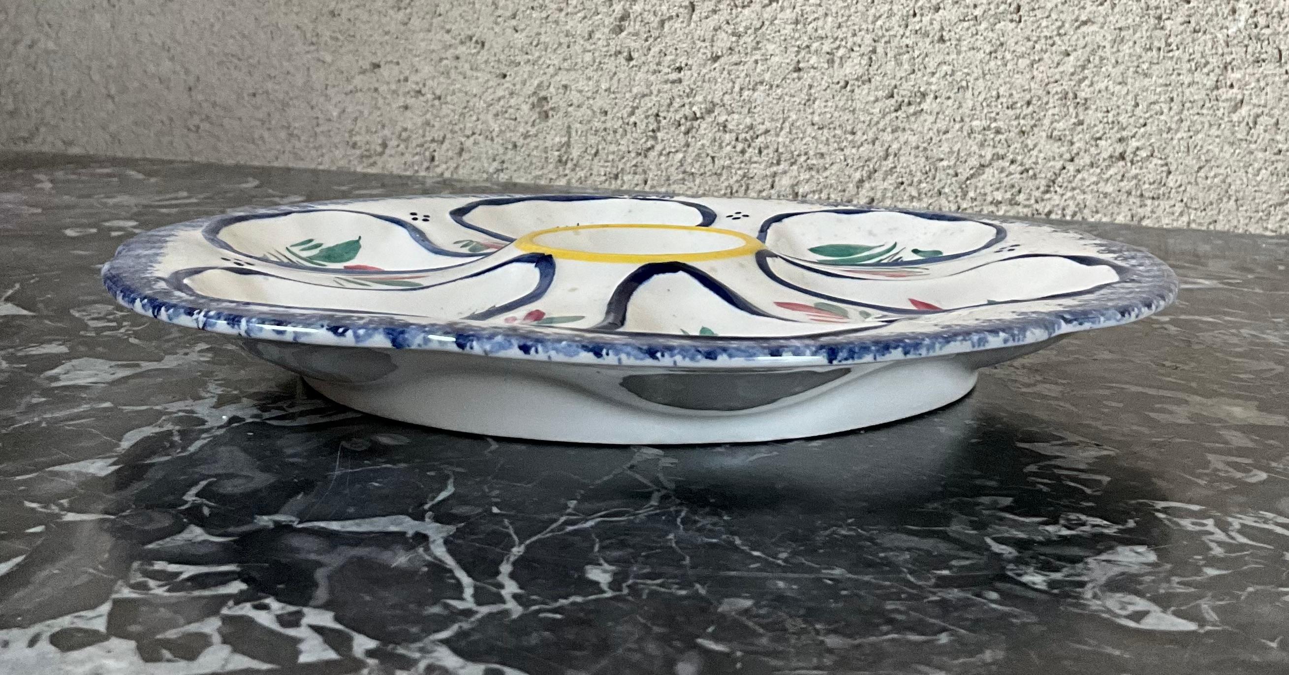 Beautiful oyster plates with 6 hollow notches and a round hollow for half lemon in the middle. They are numbered. 

These plates are rare to find, especially in good condition: no cracks. Note that two of them have a small shine. Photos show