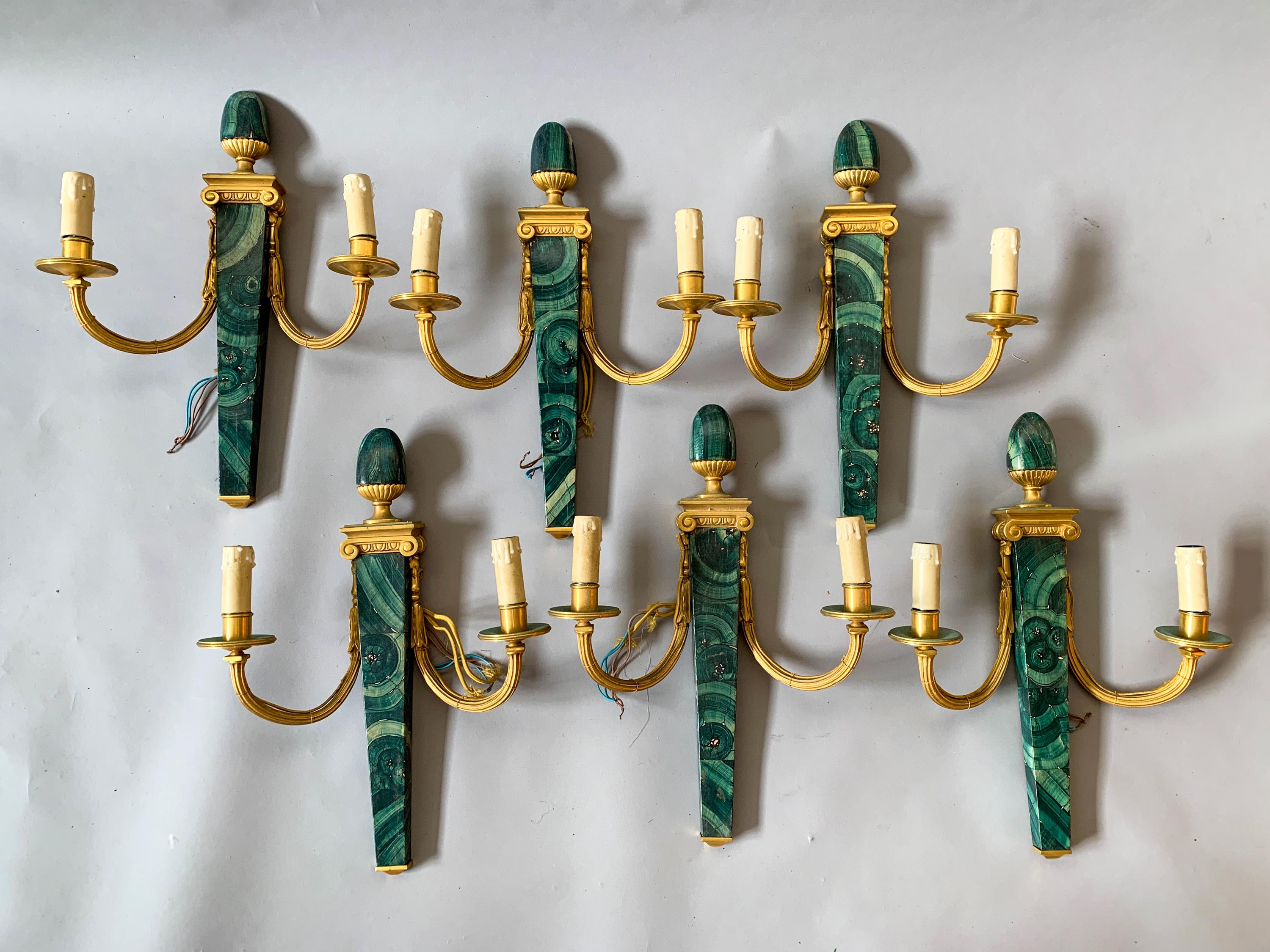 (6) 1920s faux Malachite hand painted wood and gold ormolu wall sconces with fluted and curved arms and finial to top. High quality construction. Heavy and sturdy. Price is per item.