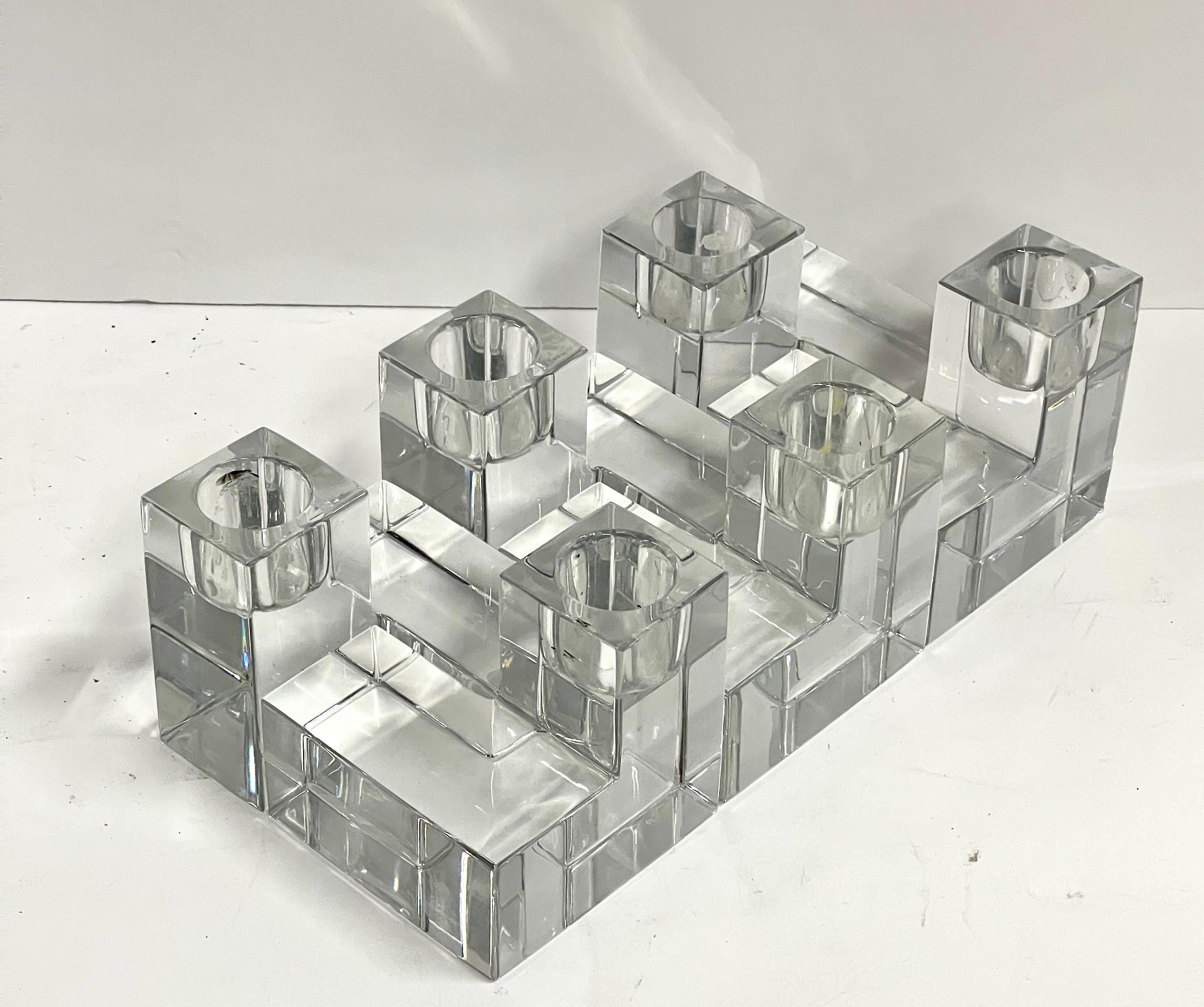 6 Wonderful cube candleholders by Baccarat. They can be configured in a myriad of positions for different looks. Each measures approximately 3x3 inches and is 2.75 inches tall. Each one bears the etched Baccarat mark. In good condition with minor
