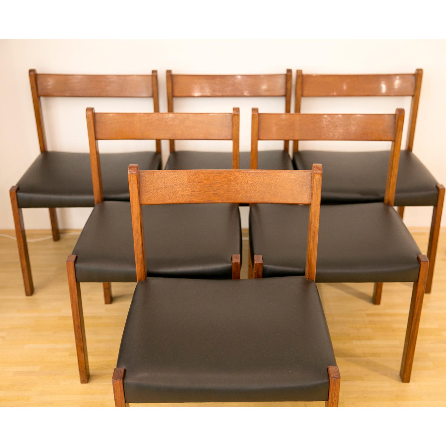 Set of 6 dining chairs in the manner of Alfred Hendrickx for Belform.
These 6 exotic wooden chairs have been covered by a brand new black faux leather.