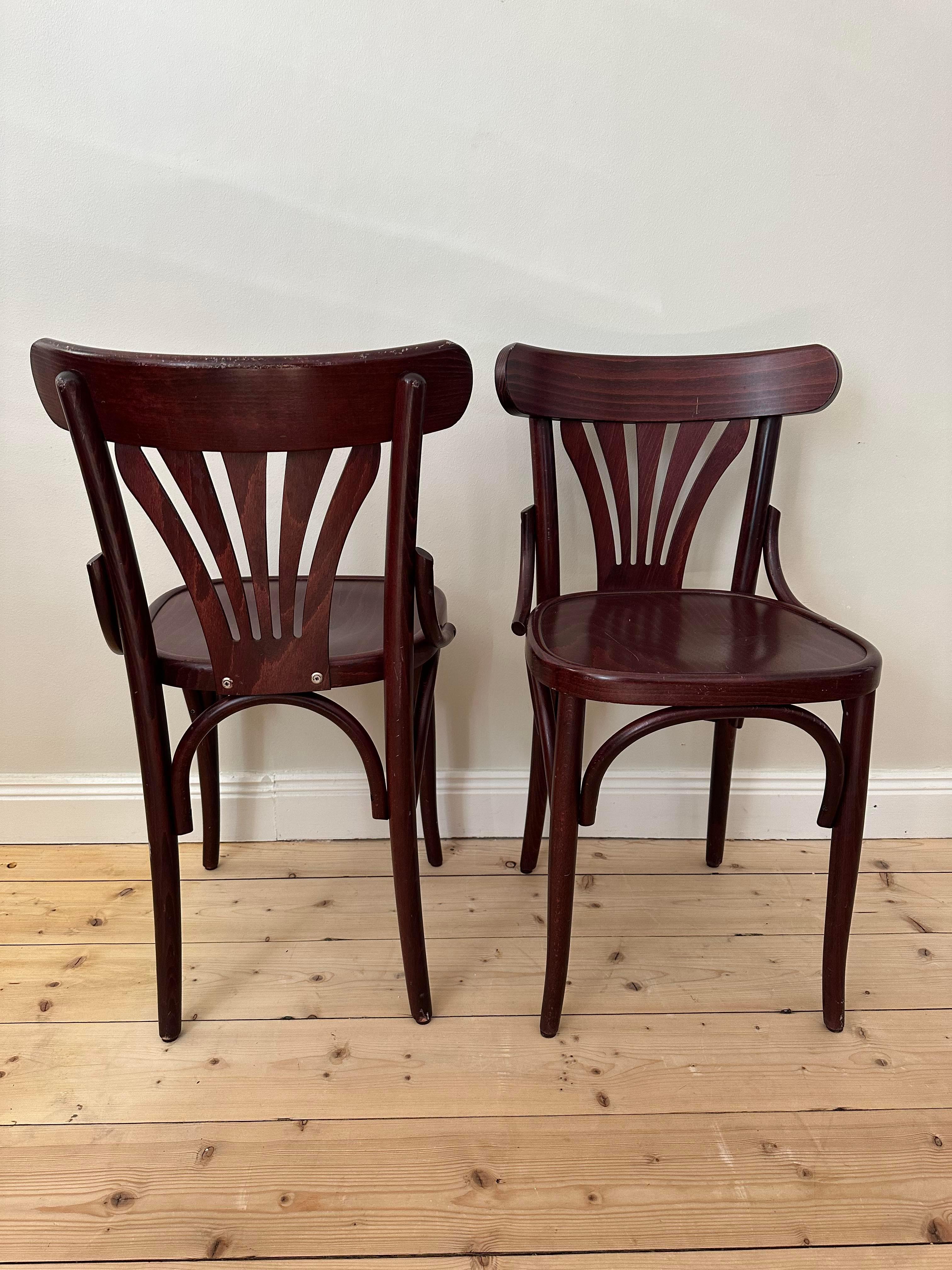 6 bistro chairs in dark red from a bistro restaurant in Paris. 
Very good condition. 
The chairs are sold in set of 6. 