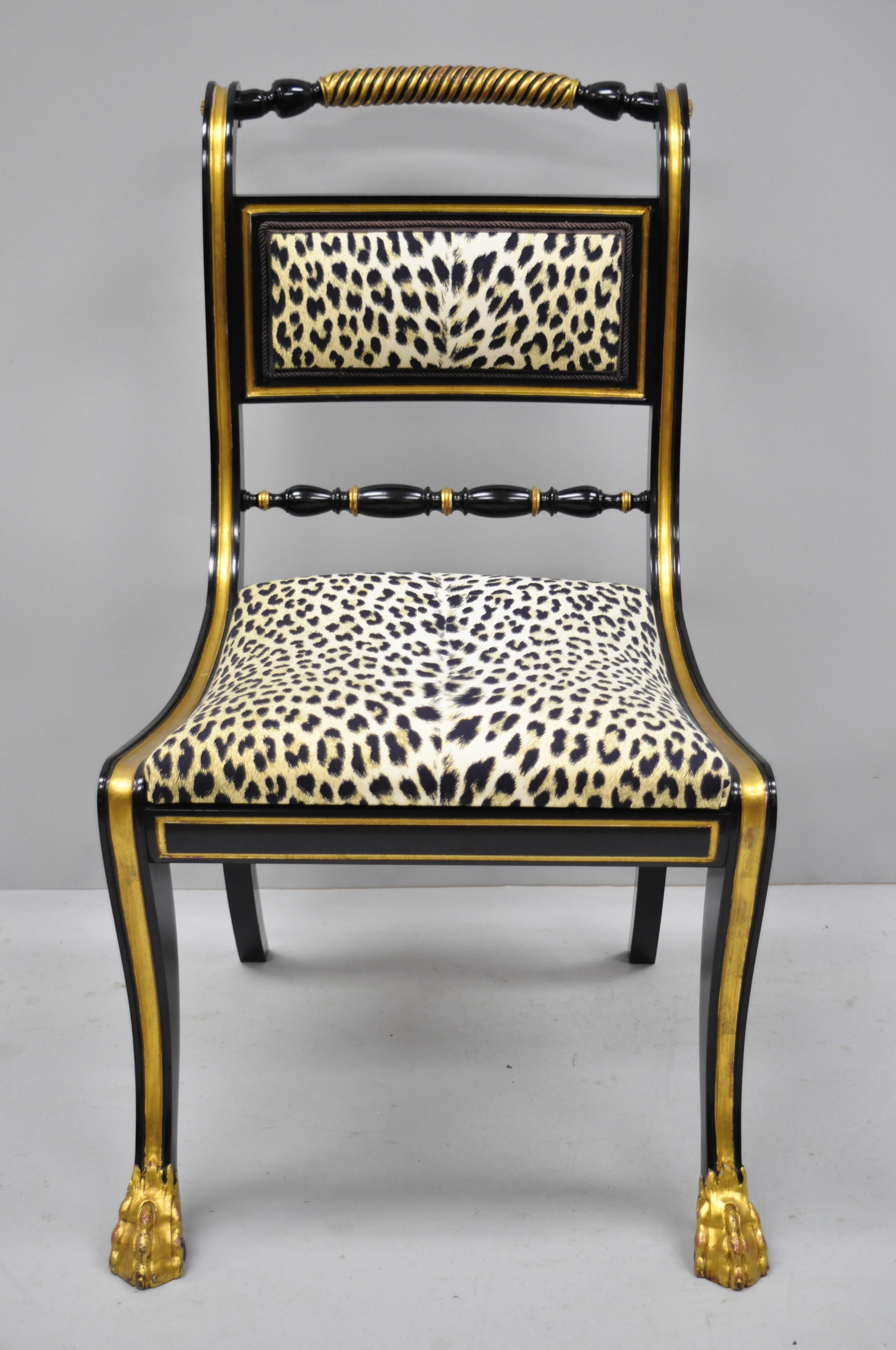 6 black and gold Regency style paw feet dining chairs leopard fabric. Listing includes hairy paw feet, distressed gold gilt finish, ebonized frames, cheetah/leopard print fabric, and solid wood construction; great style and form, circa mid-late 20th
