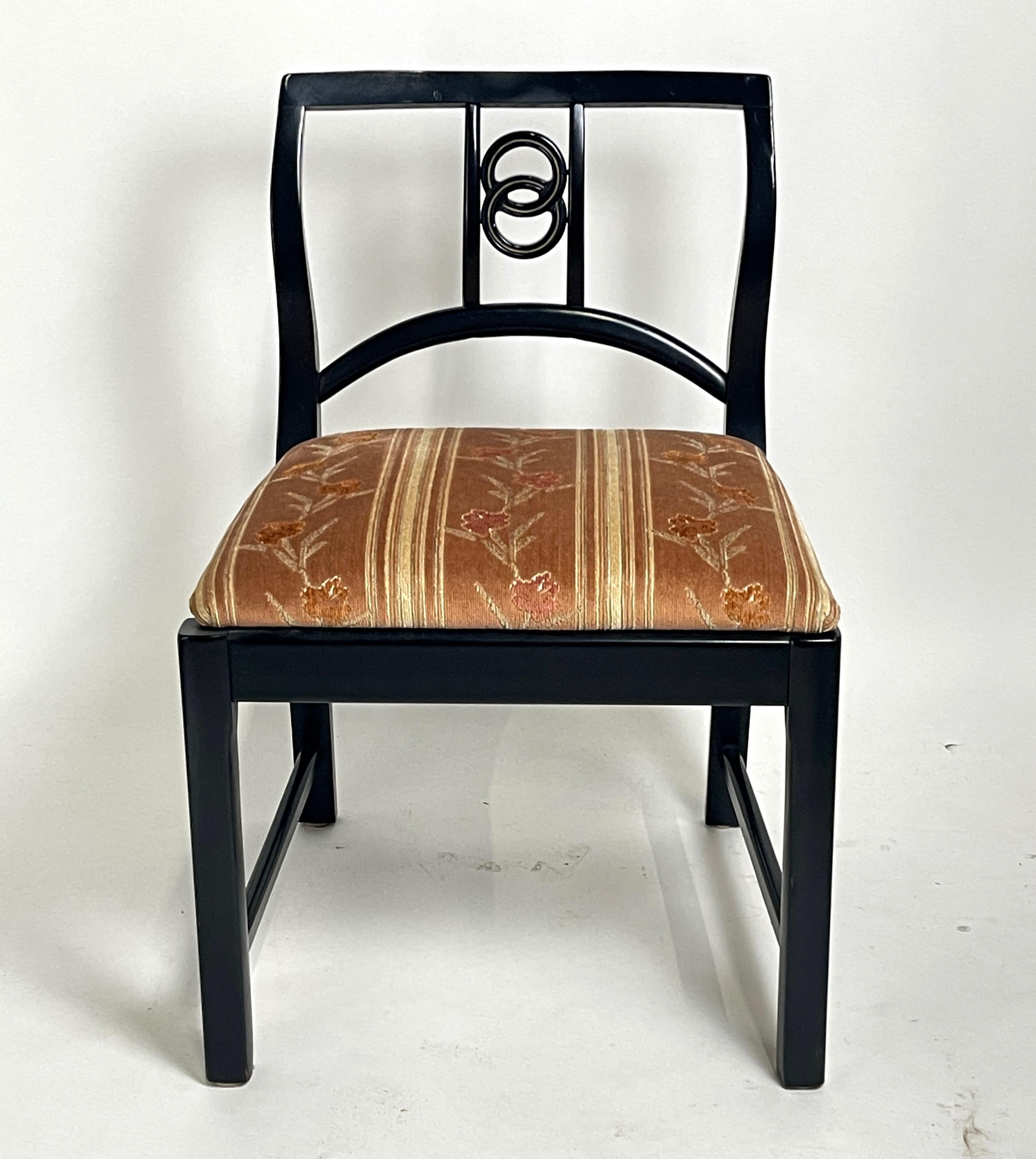 Rare and fabulous set of Michael Taylor for Baker dining chairs which includes 4 side chairs and 2 armchairs in very good original condition. The frames are constructed of a lovely semi matte lacquered mahogany while the seats are upholstered in a