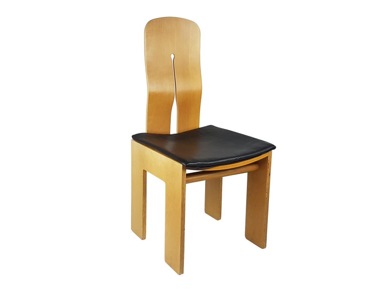 Set of 6 dining chairs. Wooden & plywood structure with black leather seats. Good condition: no restoration work. the color of the wood is lightened in some parts of the chairs due to the different exposure to the sun. Some normal signs of wear such