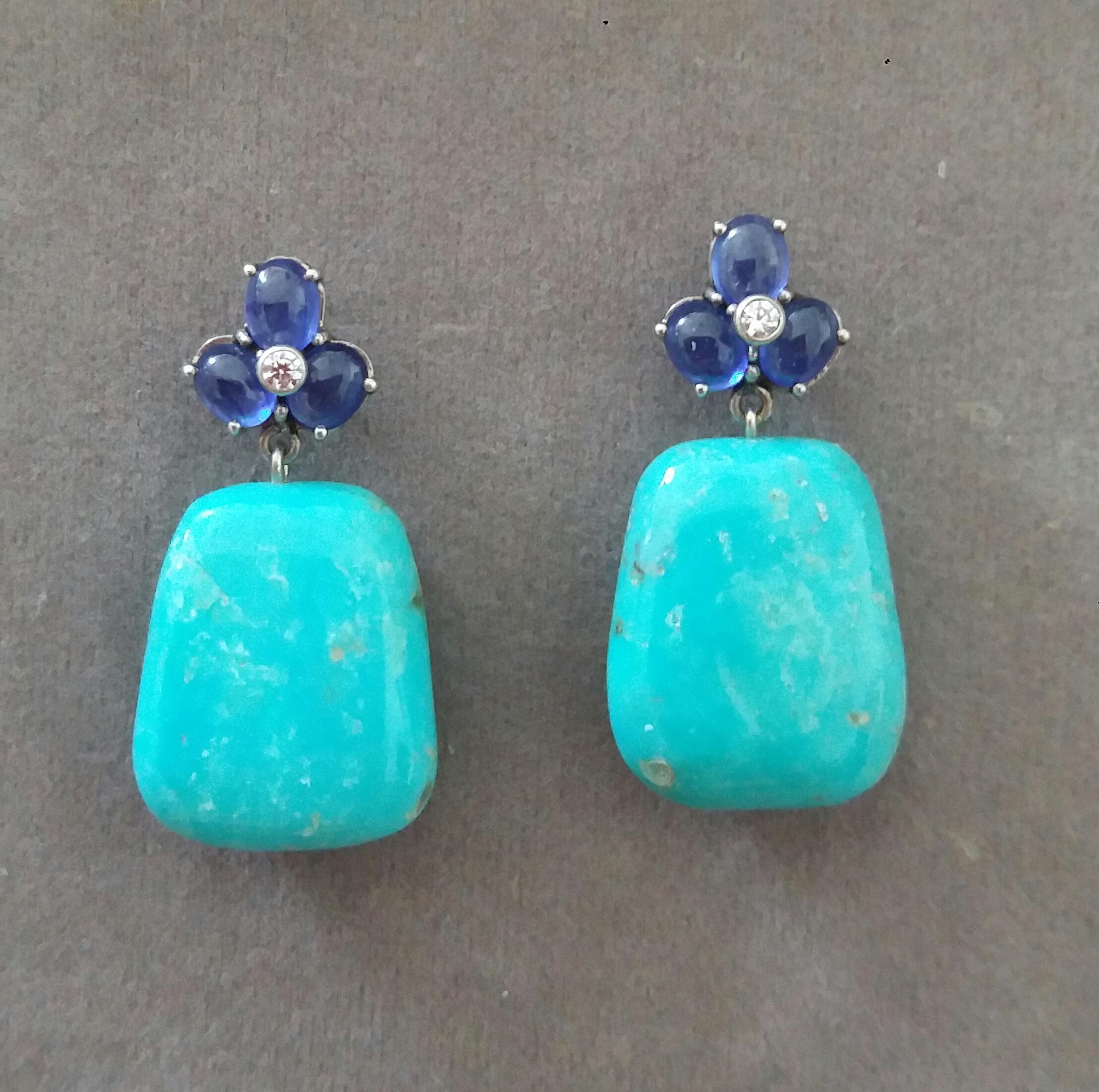 Elegant and completely handmade Earrings consisting of an upper part of 6 oval shape Blue Sapphire cabs of 4 mm x 5 mm set together in 14 Kt yellow gold with 2 small diamonds in the center, at the bottom 2 nice Trapeze Shape Natural Turquoise