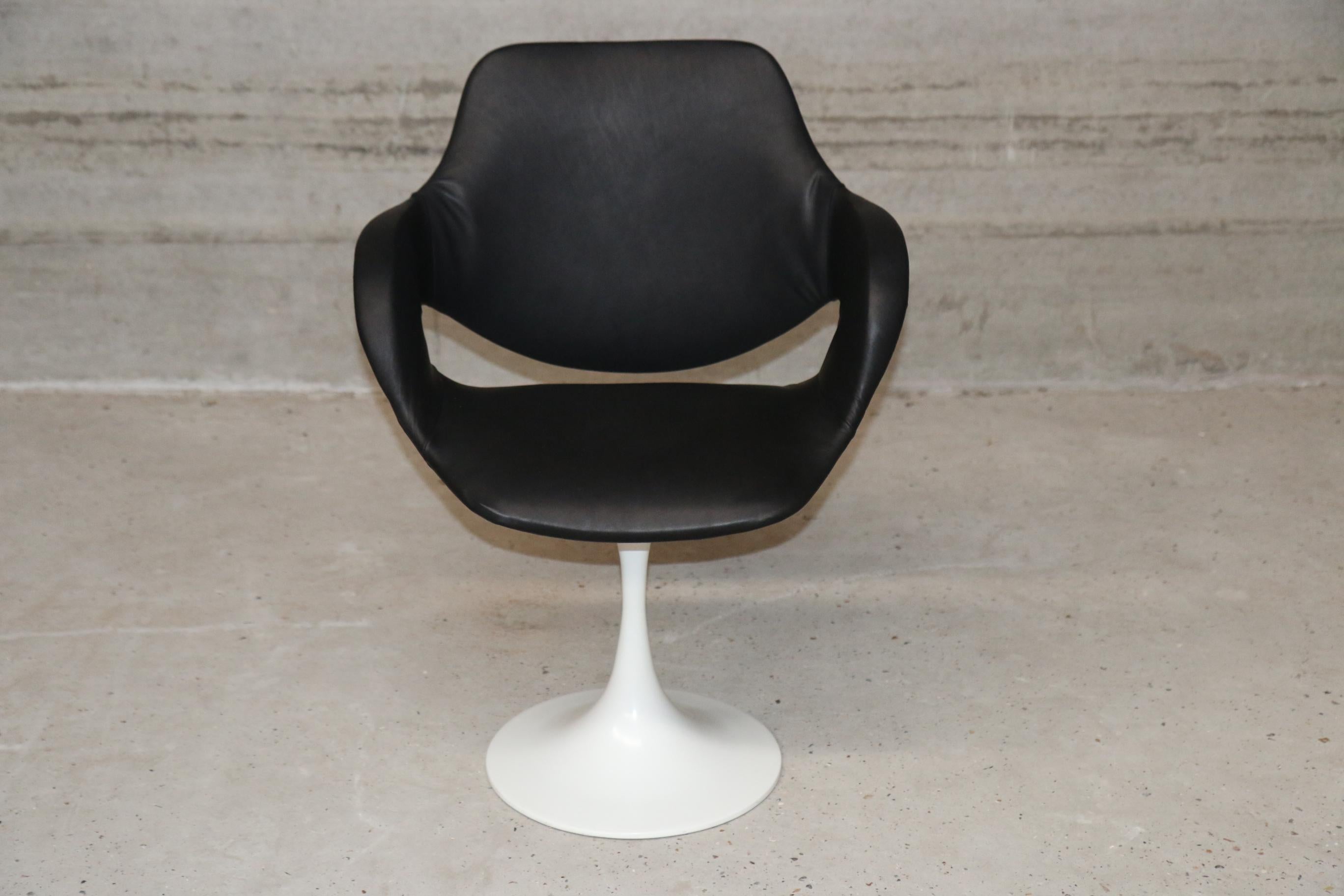 High class chairs with tulip feet in lacquered steel. Color white. Leather black, upholstered by Funkyvintage Belgium
Fits every table with it's elegancy as the back is also finished with black leather.


 