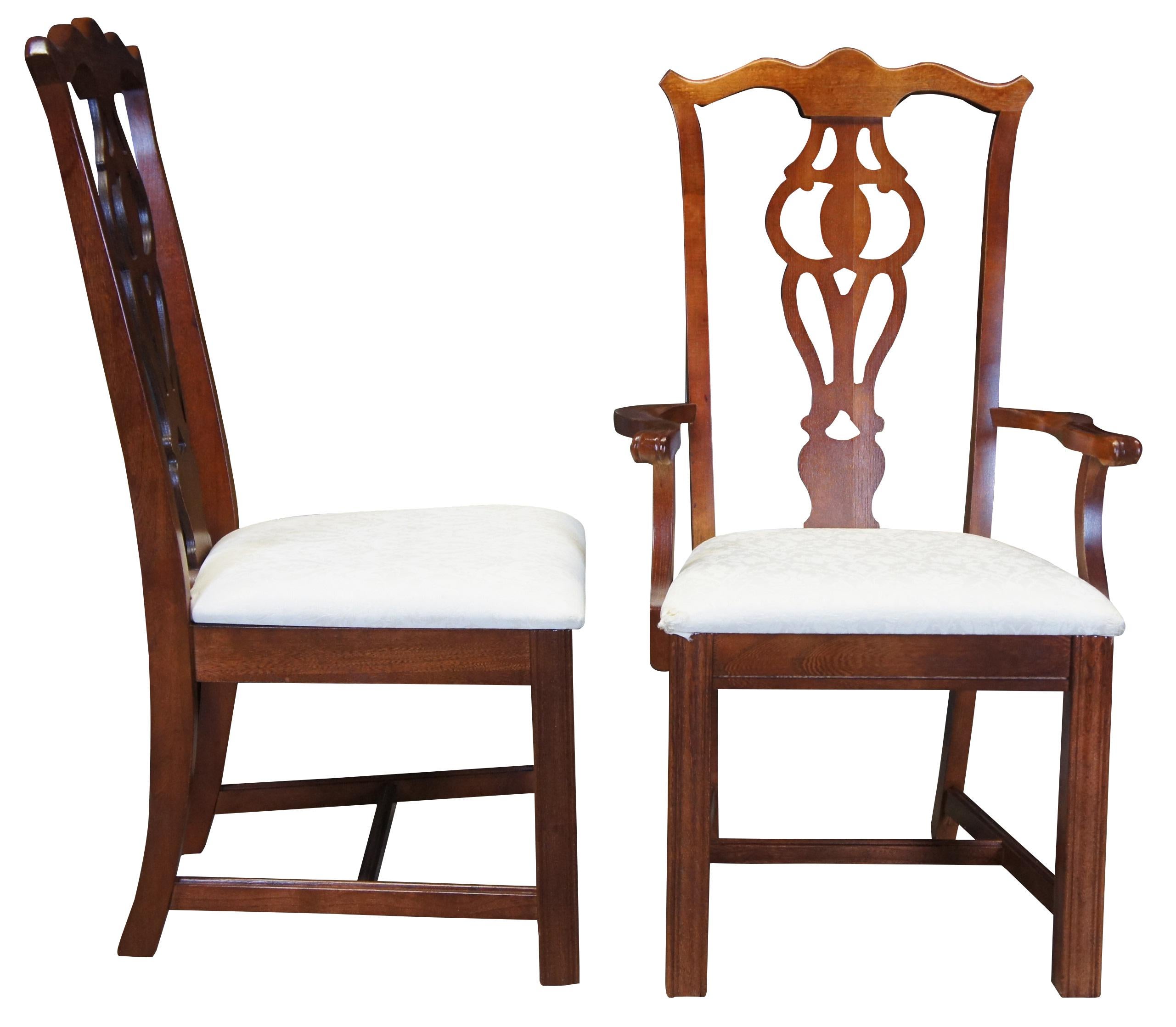 6 Broyhill dining chairs. Made from mahogany with a serpentine rail over a pierced back. Features straight front legs with a fluted design. Seats are upholstered in a white french floral design. 5265-81.
   