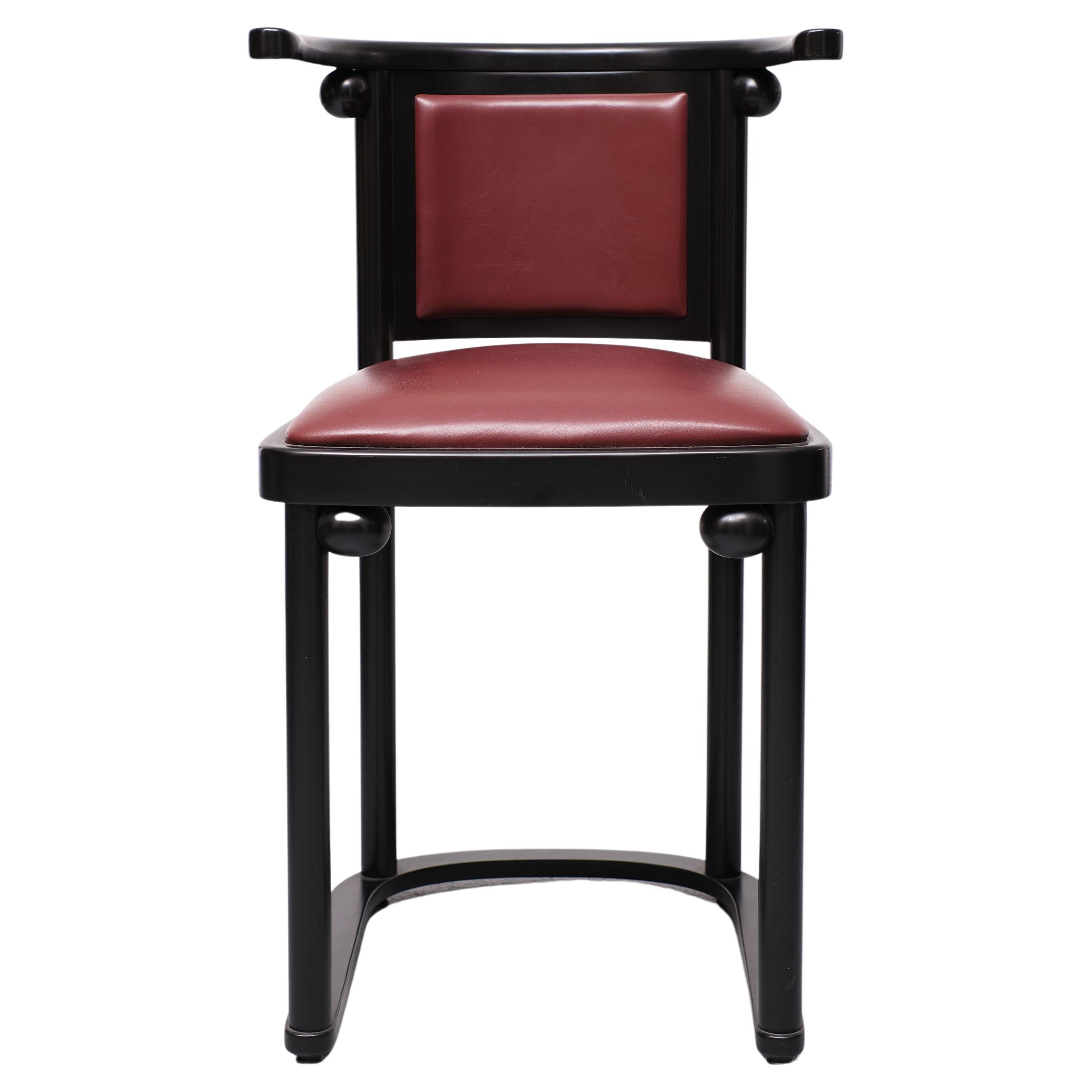 Six cafe Fledermaus armchairs. Stained Beechwood frame, comes with a Stone Red Leather upholstery. Very good condition. 
Designed in 1907 by Josef Hoffmann for the bar at the Fledermaus cabaret in Vienna. Black finished beech frame with the iconic
