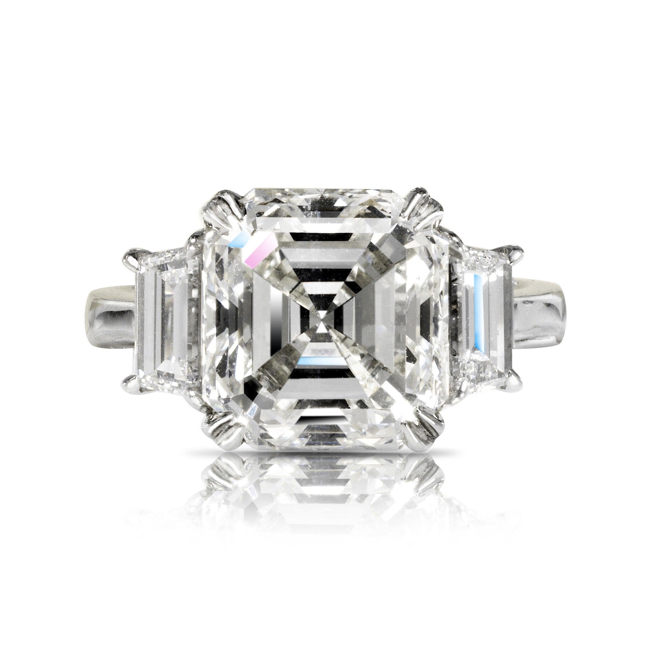 STAR ASSCHER CUT DIAMOND ENGAGEMENT RING BY MIKE NEKTA
CERTIFIED DIAMOND

Center Diamond:
Carat Weight: 5.3 Carats
Color : H
Clarity: VS2*
Style: ASSCHER CUT
Approximate Measurements: 10.2 x 9.6 x 6.6 mm 
* Clarity Enhanced  

Ring:
Metal: 14K WHITE