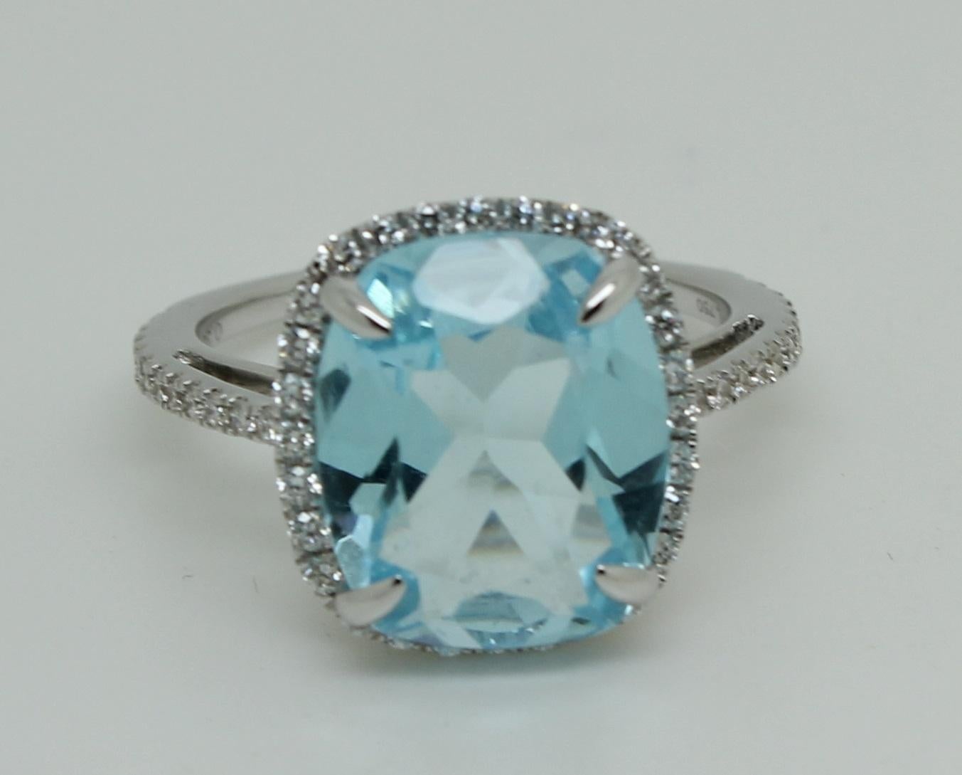 Women's 6 Carat Cushion Blue Topaz 18 Karat White Gold 0.38 Carat Diamond Halo Ring For Sale