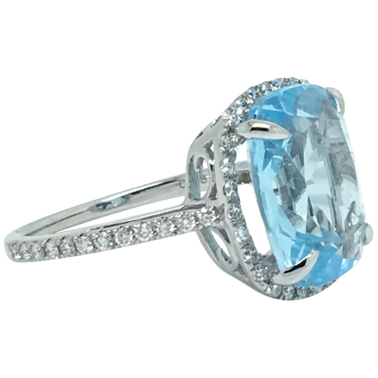 6 Carat Cushion Blue Topaz 18 Karat White Gold 0.38 Carat Diamond Halo Ring For Sale