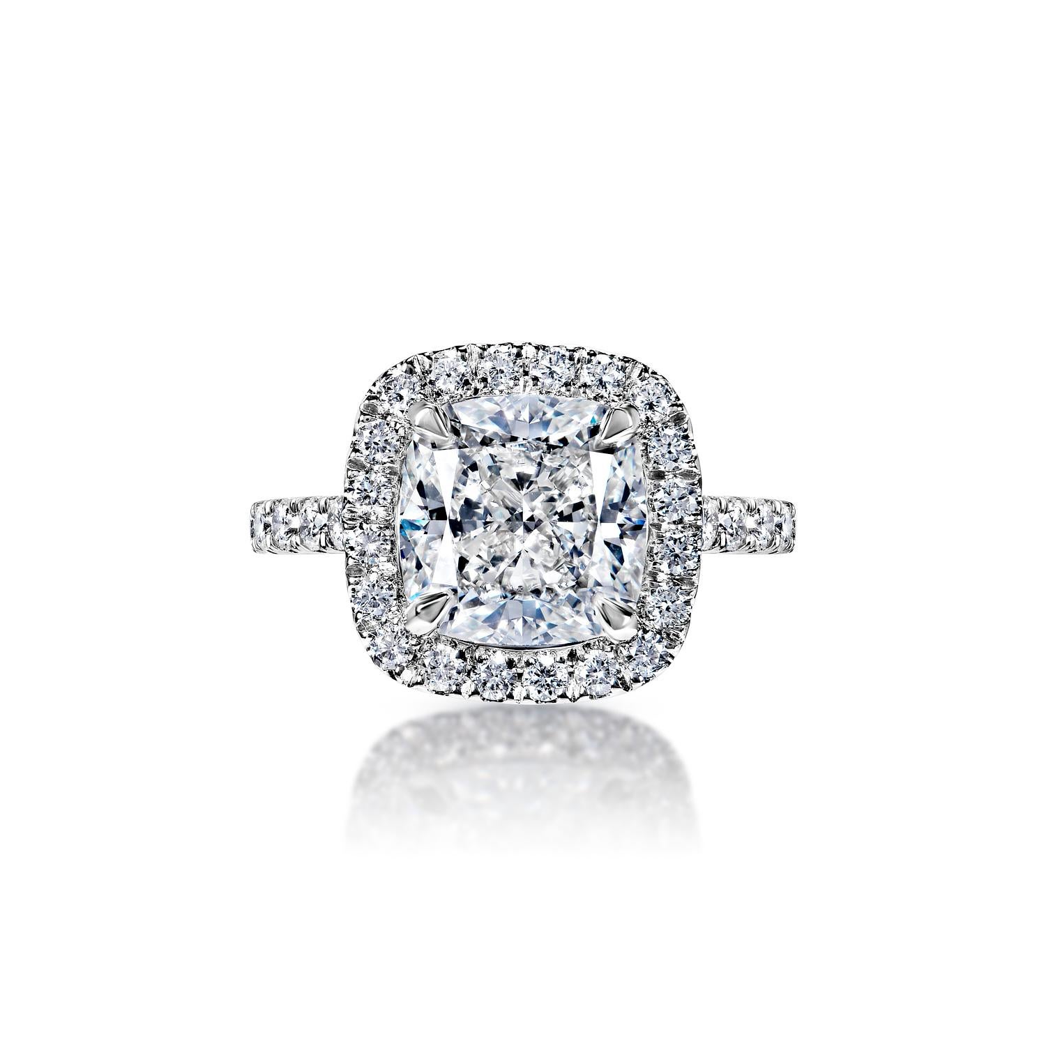 Jayleen 6 Carat I IF Cushion Cut Diamond Engagement Ring in 18k White Gold. GIA Certified. By Mike Nekta

GIA CERTIFIED
Center Diamond:

Carat Weight: 5.12 Carats
Color : I*
Clarity: IF
Style: Cushion Cut
*This Diamond has been treated by one or