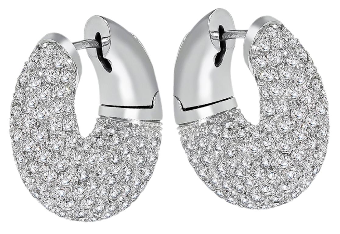 This stunning pair of 18k white gold earrings feature sparkling round cut diamonds that weigh approximately 6.00ct. graded G color with VS clarity. The earrings measure 23mm by 9mm and weigh 18.3 grams.
They earrings are stamped 750.


Inventory