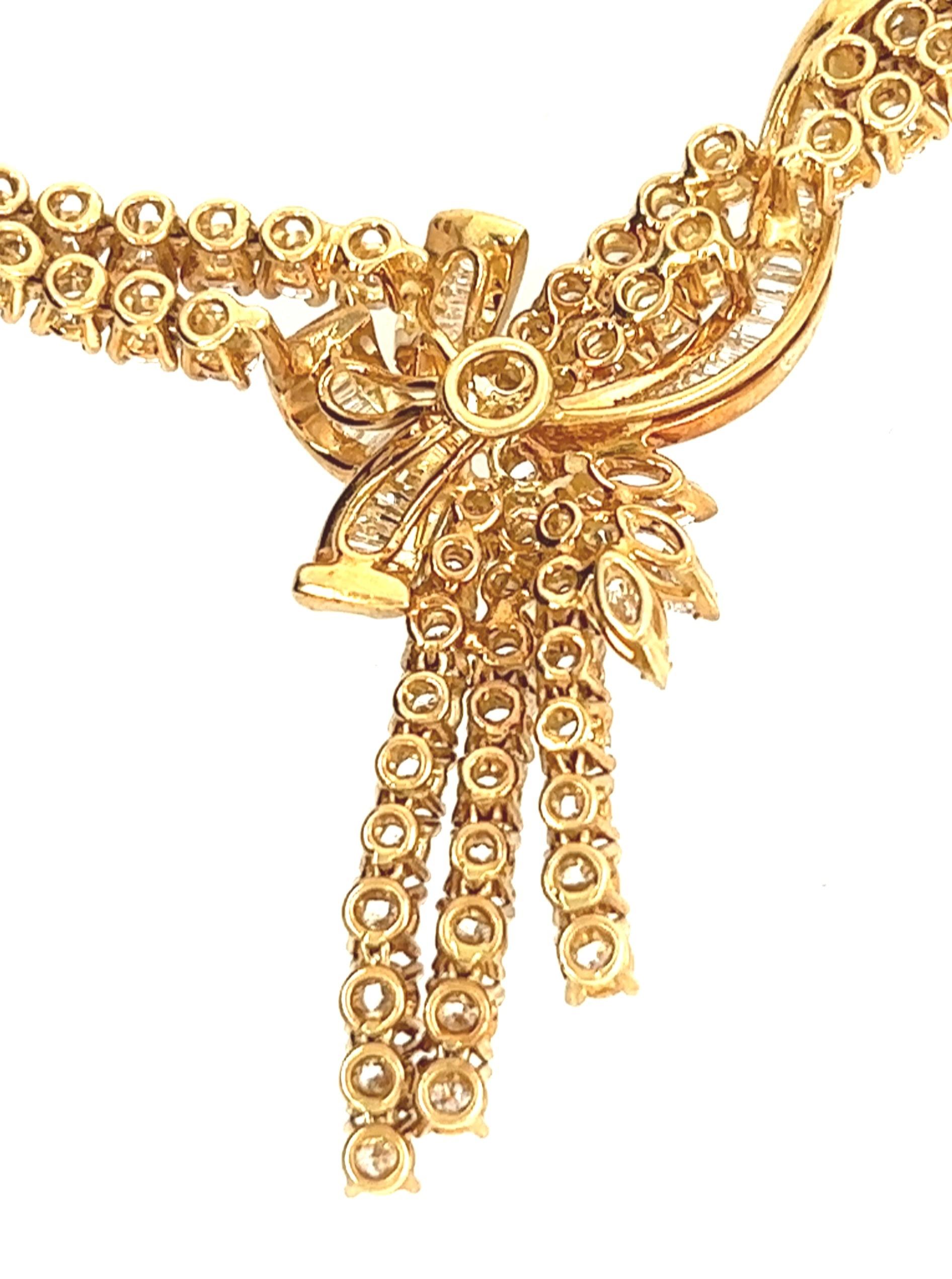 18kt yellow gold necklace 16 inches long containing approximately 6.16 carats of H-I color/ VS2-SI1 clarity diamonds. 

The necklace contains a center portion of almost 4 inches of diamonds in two rows. The center of the diamond portion contains a