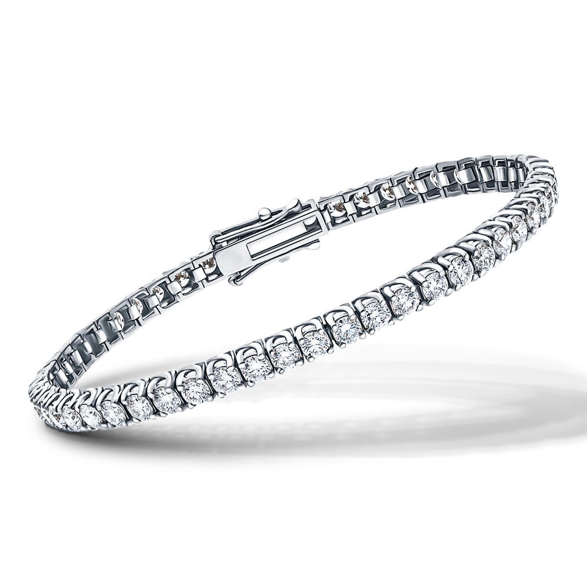 This fantastic 6 Carats Round Brilliant Cut Diamonds White Color G / H Clarity SI1 are set in 18 Karat White Gold for this stunning tennis bracelet. Set in a four claw cross over / tulip design with a security clasp. Other carat sizes available upon