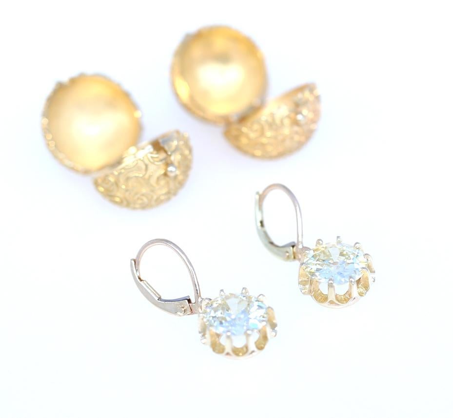Diamond earrings transforming into a Gold sphere. 5.3 Ct old cut Diamonds. Certified. Colour K Quality VS2. The Colour perfectly matched to gold. Fine craft of the jeweler. A special sphere is produced, which easily clips on top of the Diamonds to
