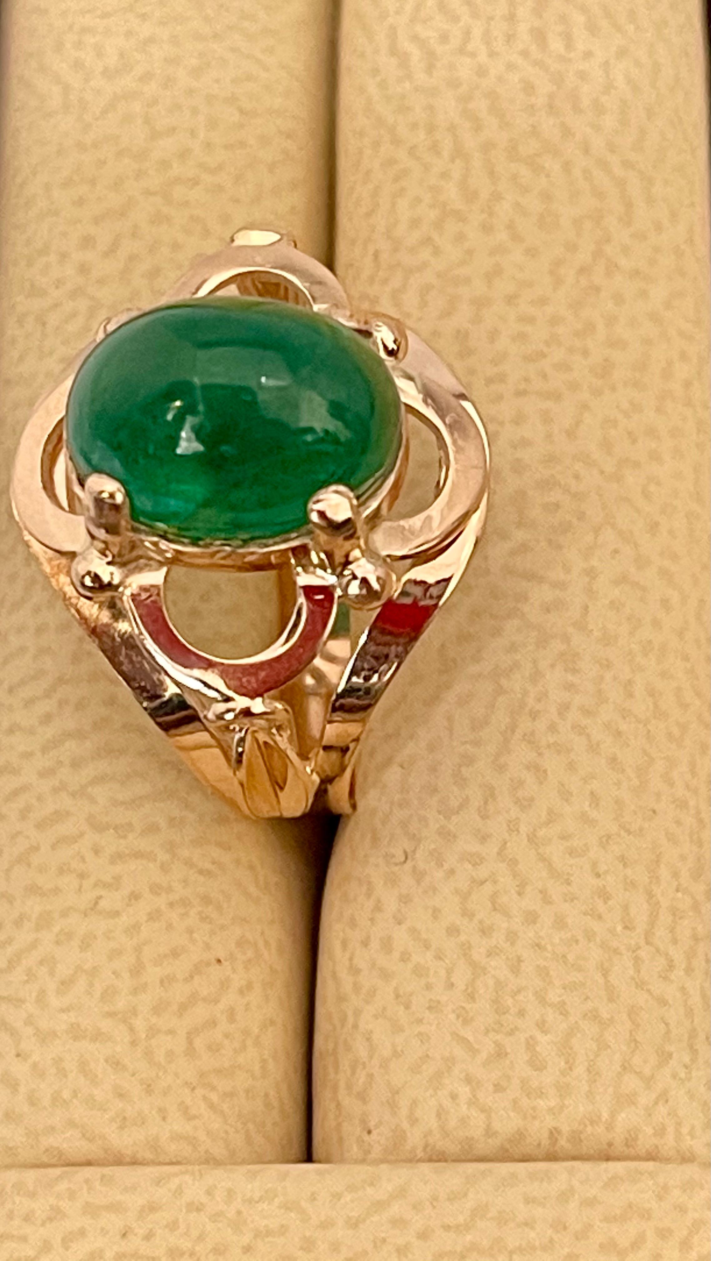 A classic, Cocktail ring 
Large size Emerald  cabochon approximately 6.2 Carat Emerald , Estate with no color enhancement. 
Gold: 14 Karat Rose   gold ,
Weight: 5.7  gram with stone 
simple ring , no bling 
Emerald: 6.2 Carat 
Origin : Zambia
Color: