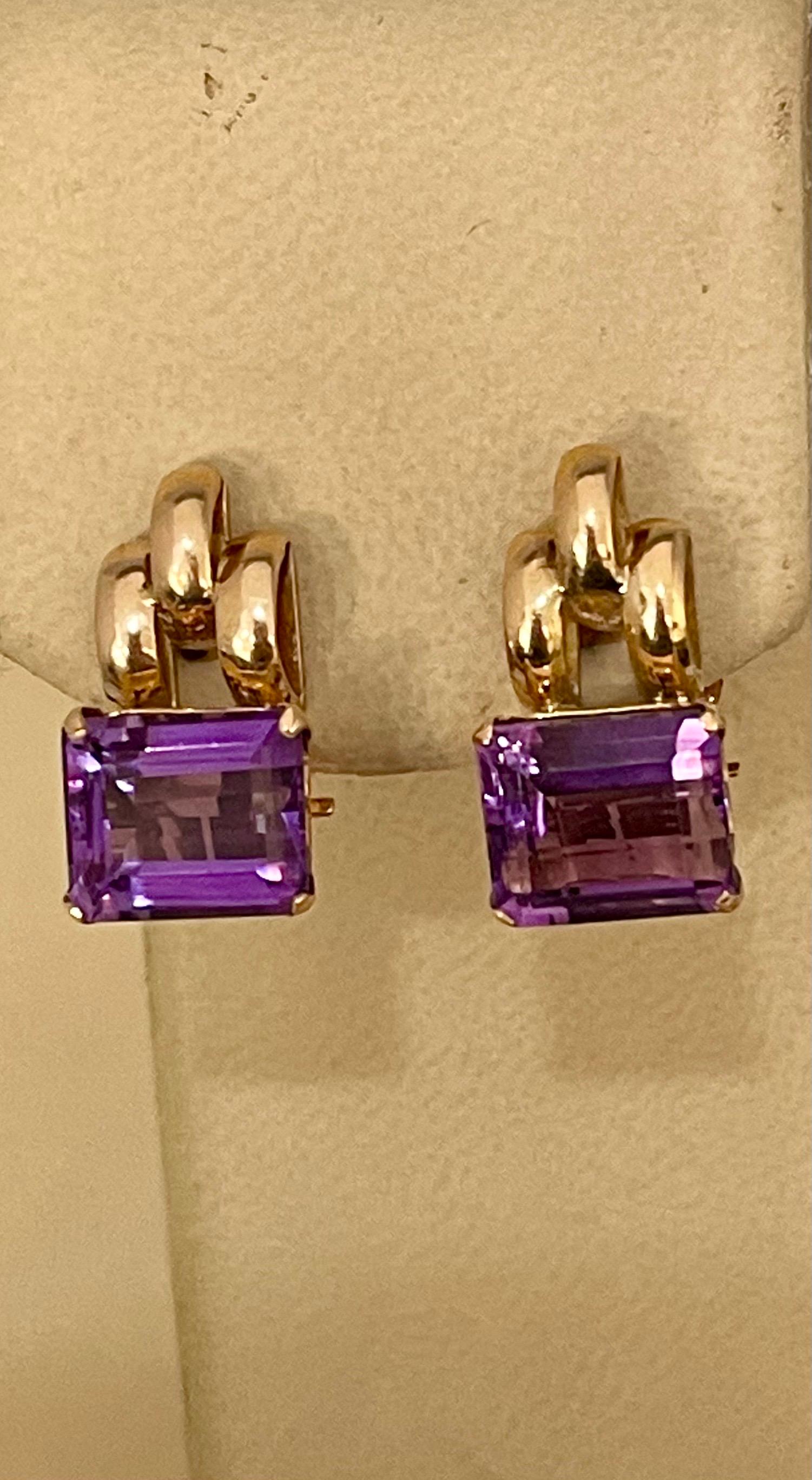 Approximately 6 Carat Emerald Cut Amethyst  14 Karat Yellow Gold Clip  Earrings
Beautiful pair of earrings  finely crafted in  14 Karat  solid Yellow gold.
Nice quality but color of amethyst  is light
perfect pair made in 14 Karat Yellow  gold
total