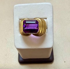 6 Carat Emerald cut Amethyst Unisex Bezel Set Cocktail Ring in 18 Kt Yellow Gold