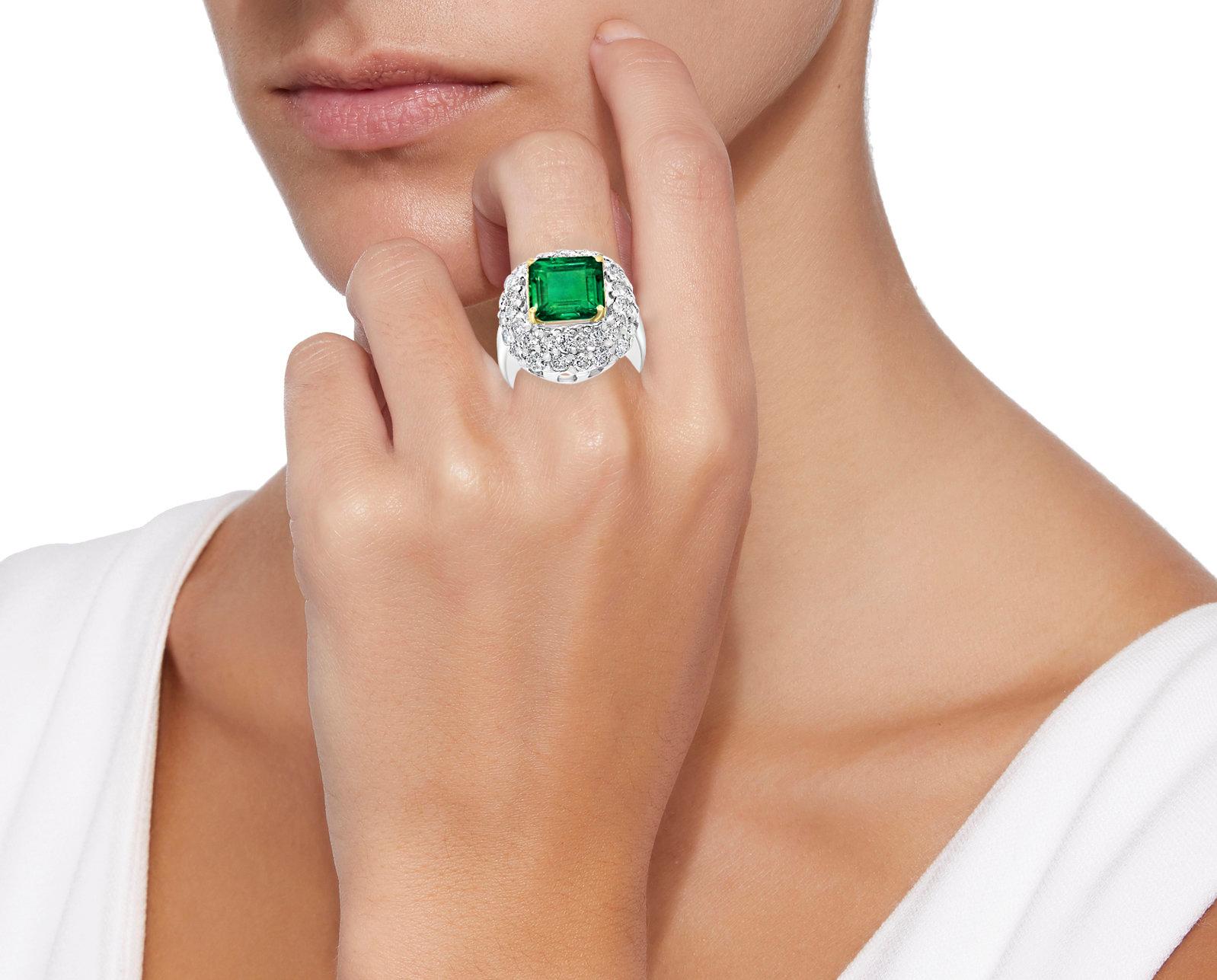 
6 Carat Emerald Cut Colombian Emerald and 4 Ct Diamond Ring Platinum, Two-Tone
A classic, Cocktail ring 
6 Carat  Colombian Emerald Absolutely gorgeous emerald , Very desirable color 
Platinum 20 gm
 Diamonds: approximate 4 Carat 
Emerald: 6