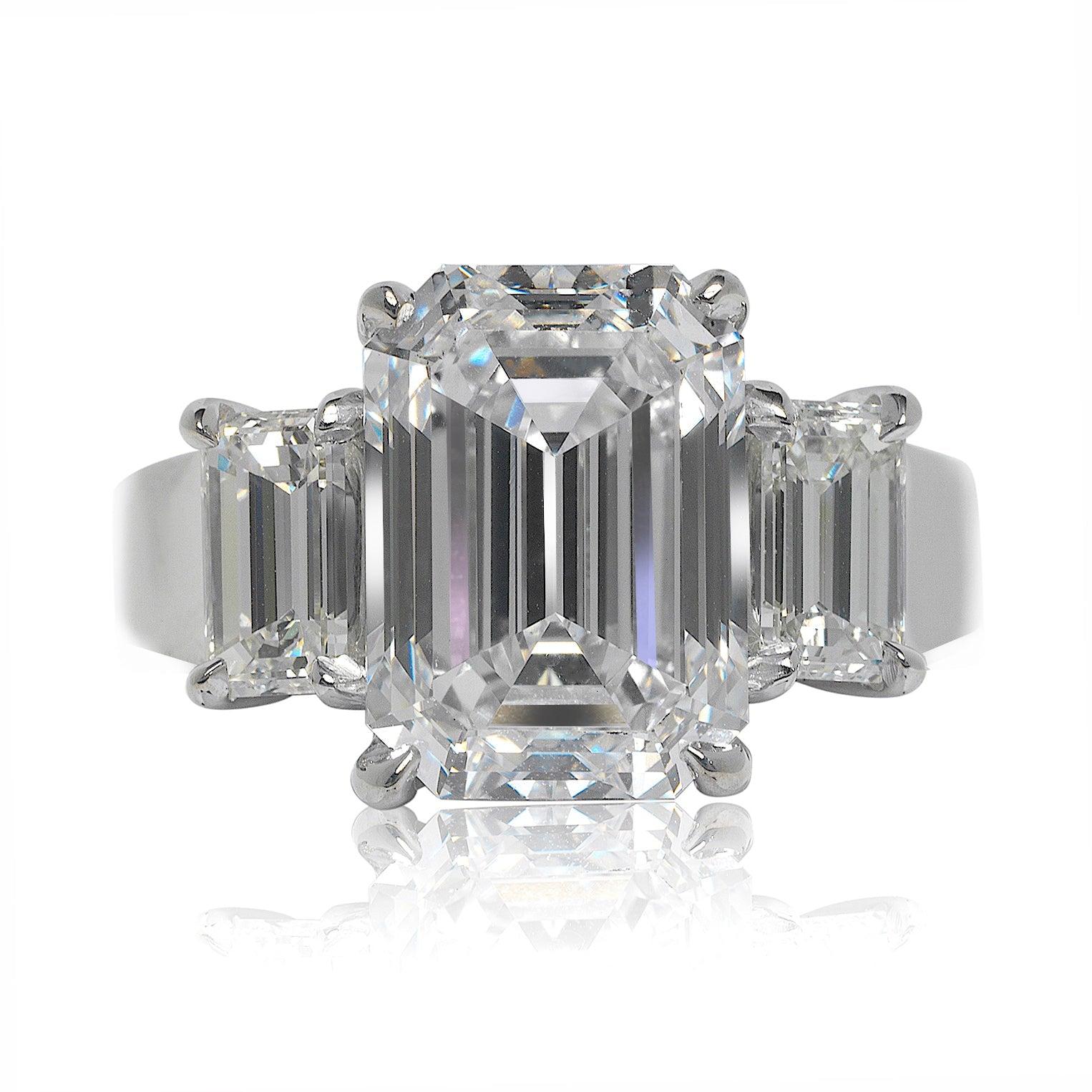 SHAE  EMERALD CUT THREE STONE DIAMOND ENGAGEMENT RING 14K WHITE GOLD
GIA CERTIFIED

Center Diamond
Carat Weight: 5 Carats
Color :   D*
Clarity:  VVS1
Cut: EMERALD CUT
Measurements: 11.4 x 8.1 x 5.6 mm
*Color Treated

Ring:
Metal: 14K WHITE