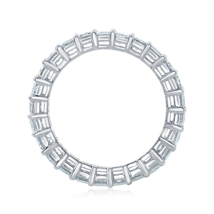 Emerald Cut diamonds set in a platinum eternity ring. Each stone weighs approximately 0.25 carats. The ring is set with 21 stones. The total carat weight is 5.84. The stones are F color, the clarity is VVS1-VVS2. The ring is a size 6.5.