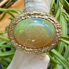 6 Carat Ethiopian Opal in "Crunchy" 18K Gold East-West Solitaire Bezel Ring