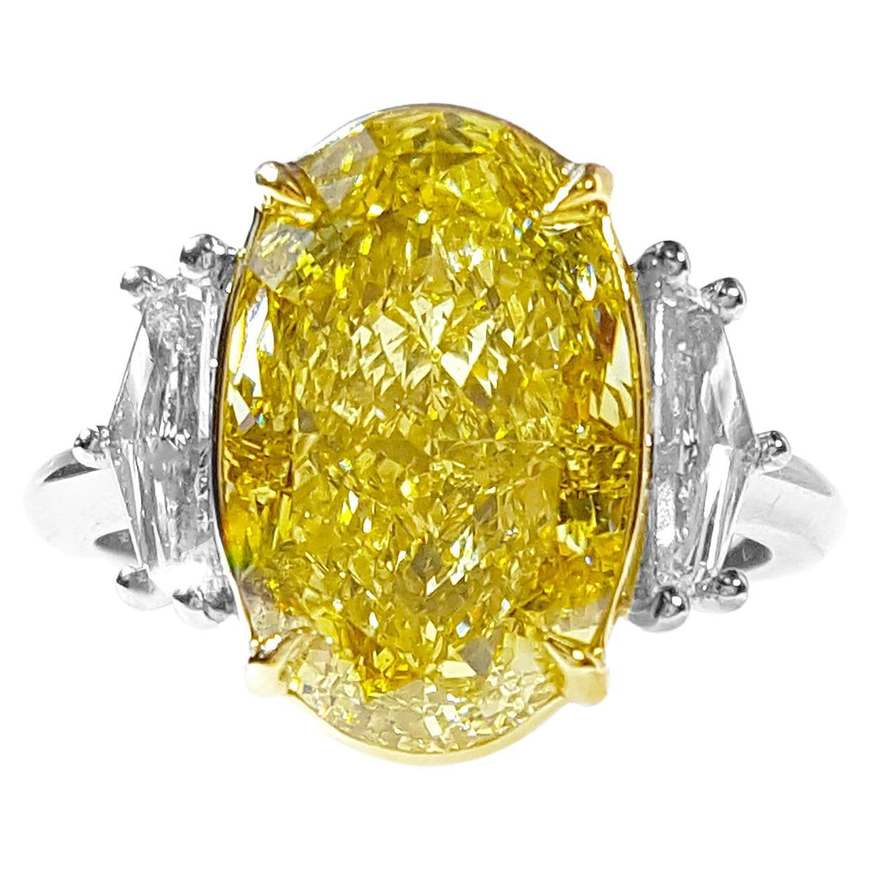 6 Carat Fancy Intense Yellow Diamond Three-Stone Engagement Ring, GIA Certified.