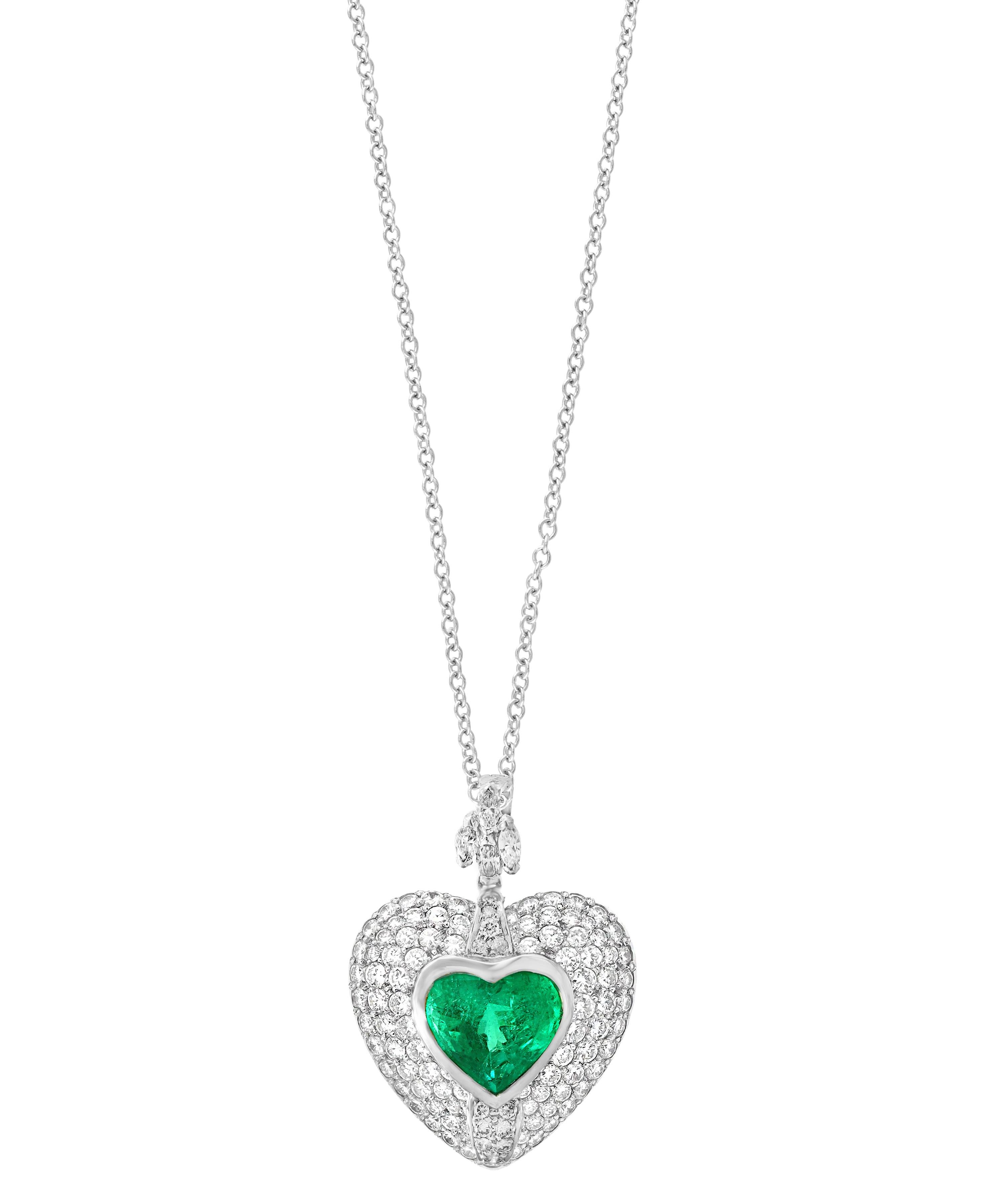 Approximately 5 Carat Heart shape Colombian Emerald and Diamond Pendant Necklace Enhancer
This spectacular Pendant Necklace consisting of a single Heart shape emeralds approximately 5 Carat. The perfect Heart Shape Emerald is surrounded by