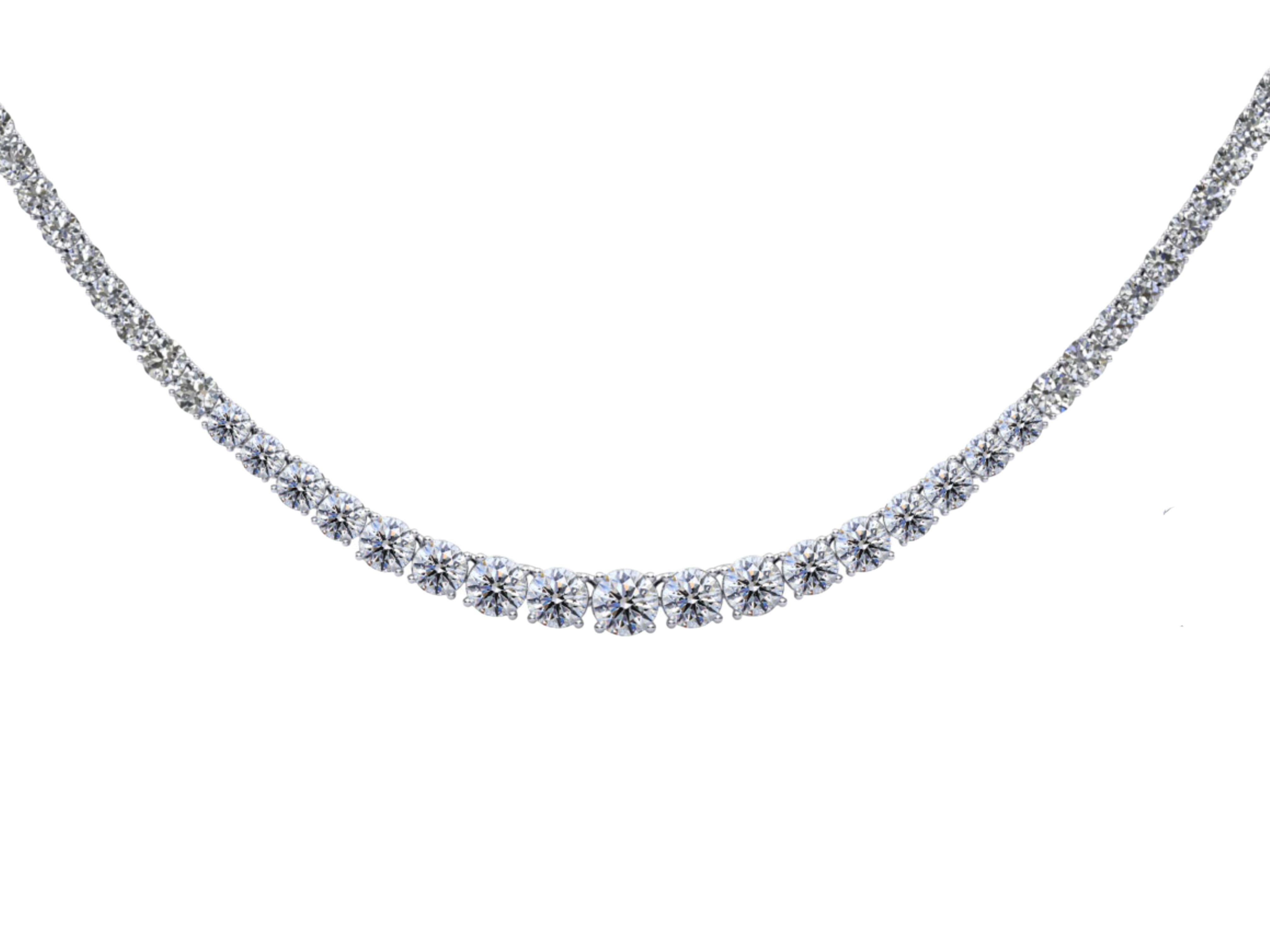 Platinum sets 17 inches of round cut natural diamonds in a classic 4 prong riviera setting. The diamonds graduate in size from 4.5mm to 2.5mm. This is the classic diamond tennis necklace of your dreams. Made with natural, untreated diamonds and a