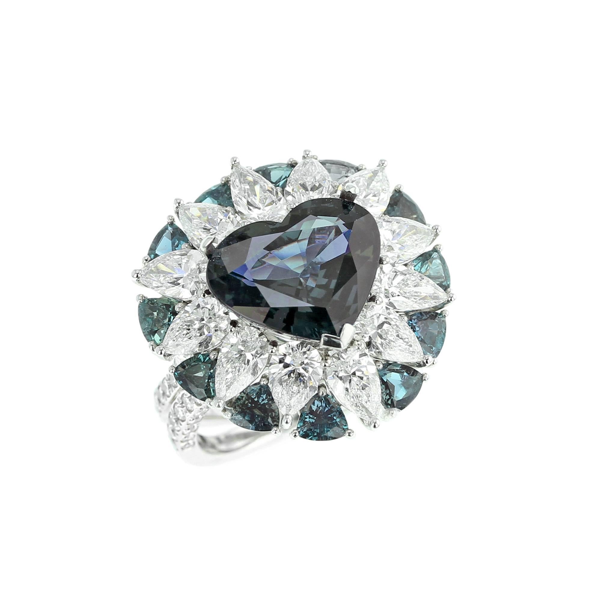 An impressive and beautiful natural, heart-shaped Alexandrite from Brazil, weighing over six carats, accented with diamonds weighing appx. 5.6 cts. (E-F Color, VS Clarity) and alexandrites weighing appx. 2.10 cts., set in Platinum. The Alexandrite