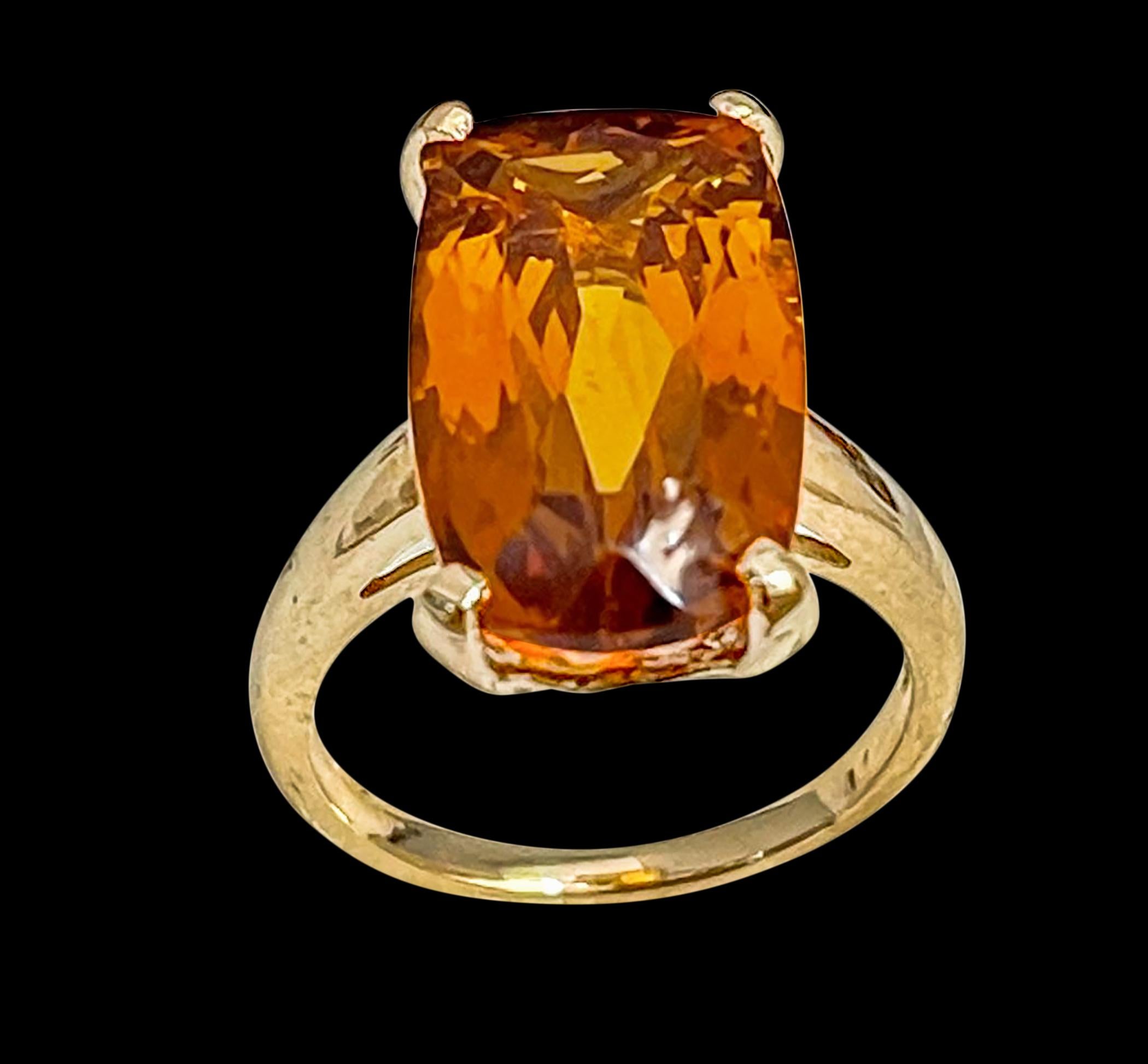 Approximately 6 Carat Natural  Very long Cushion shape  Citrine Cocktail  Ring in 14 Karat Yellow Gold, Estate , Size 5.2

This is a ring which has a  approximately  6 carat of high quality Citrine stone. The stone is 10X17 MM 
Color and clarity is