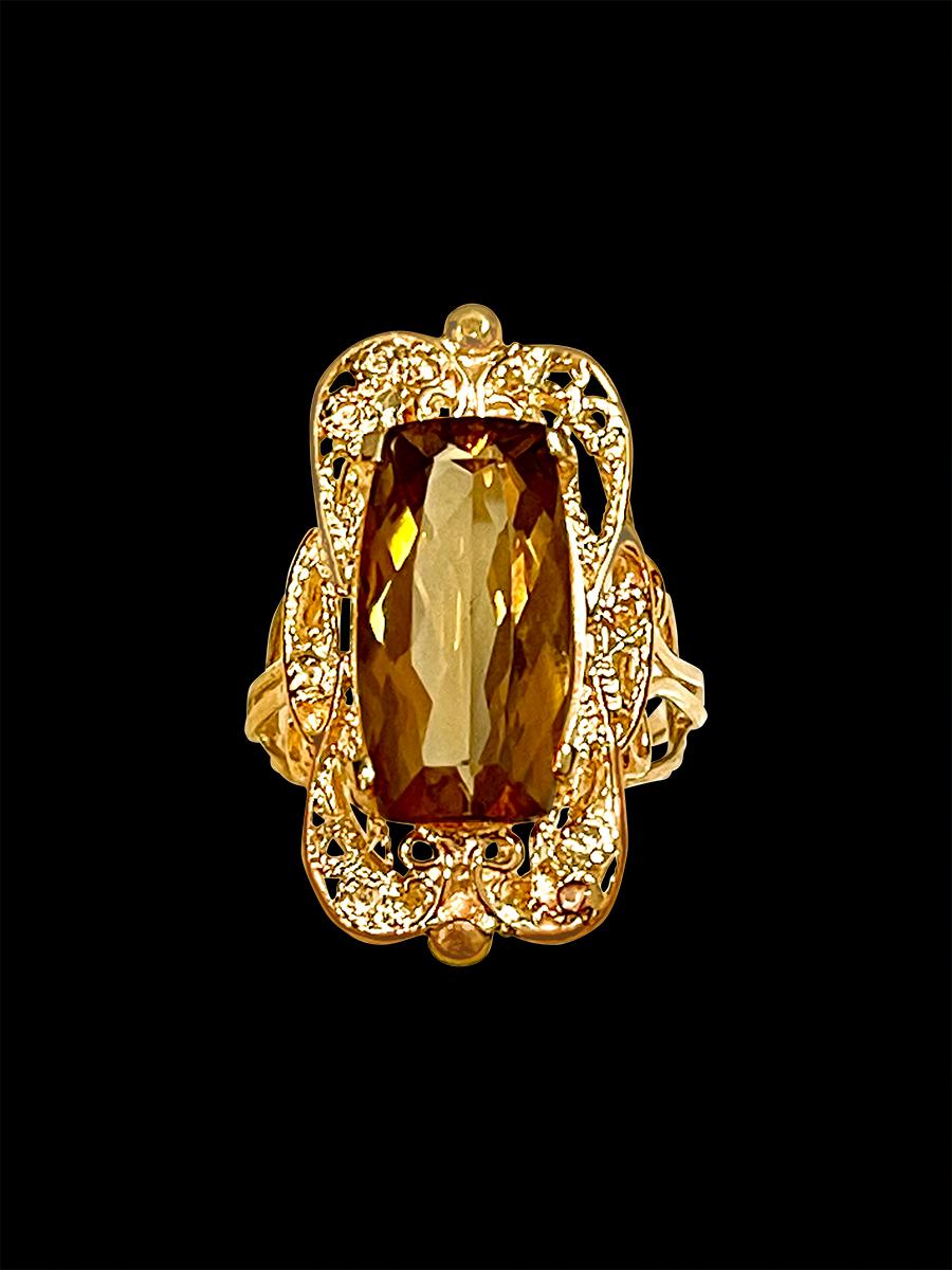 Approximately 6 Carat Natural  Very long Cushion shape  Citrine Cocktail  Ring in 14 Karat Yellow Gold, Estate , Size 6.5

This is a ring which has a  approximately  6 carat of high quality Citrine stone. The stone is 10X17 MM 
Color and clarity is