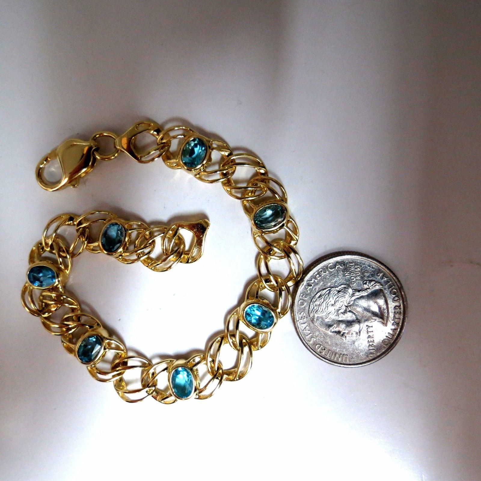 Vintage Feminine Classic

6.00ct. Topaze bleue suisse naturelle (7) Bracelet. 

Coupes ovales, clarté nette et transparente.

Gamme : 6 x 4mm chacun. 

or jaune 14kt 

19 grammes.

8 pouces (longueur portable)
