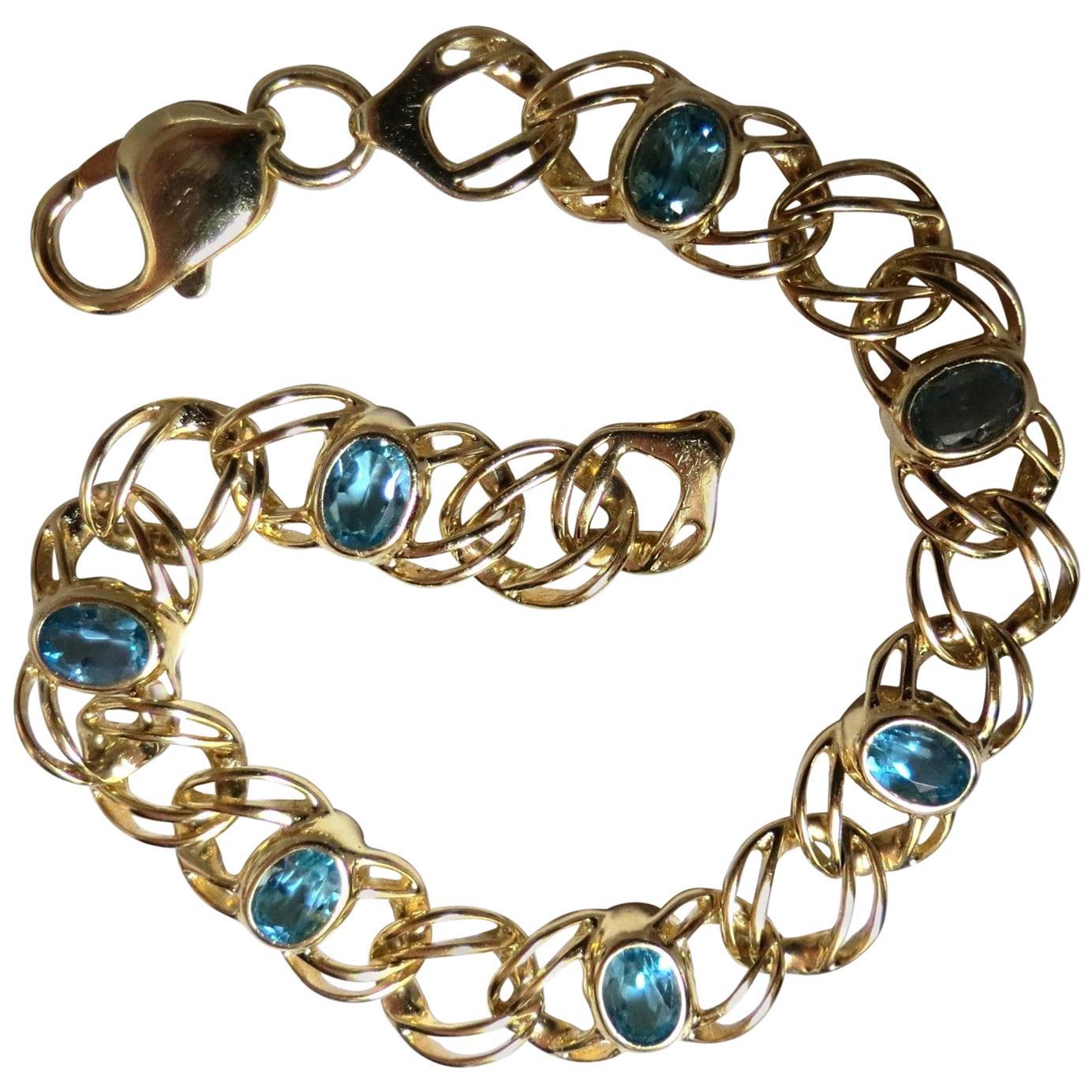 Bracelet vintage déco en or 14 carats avec topaze bleue naturelle suisse de 6 carats en vente