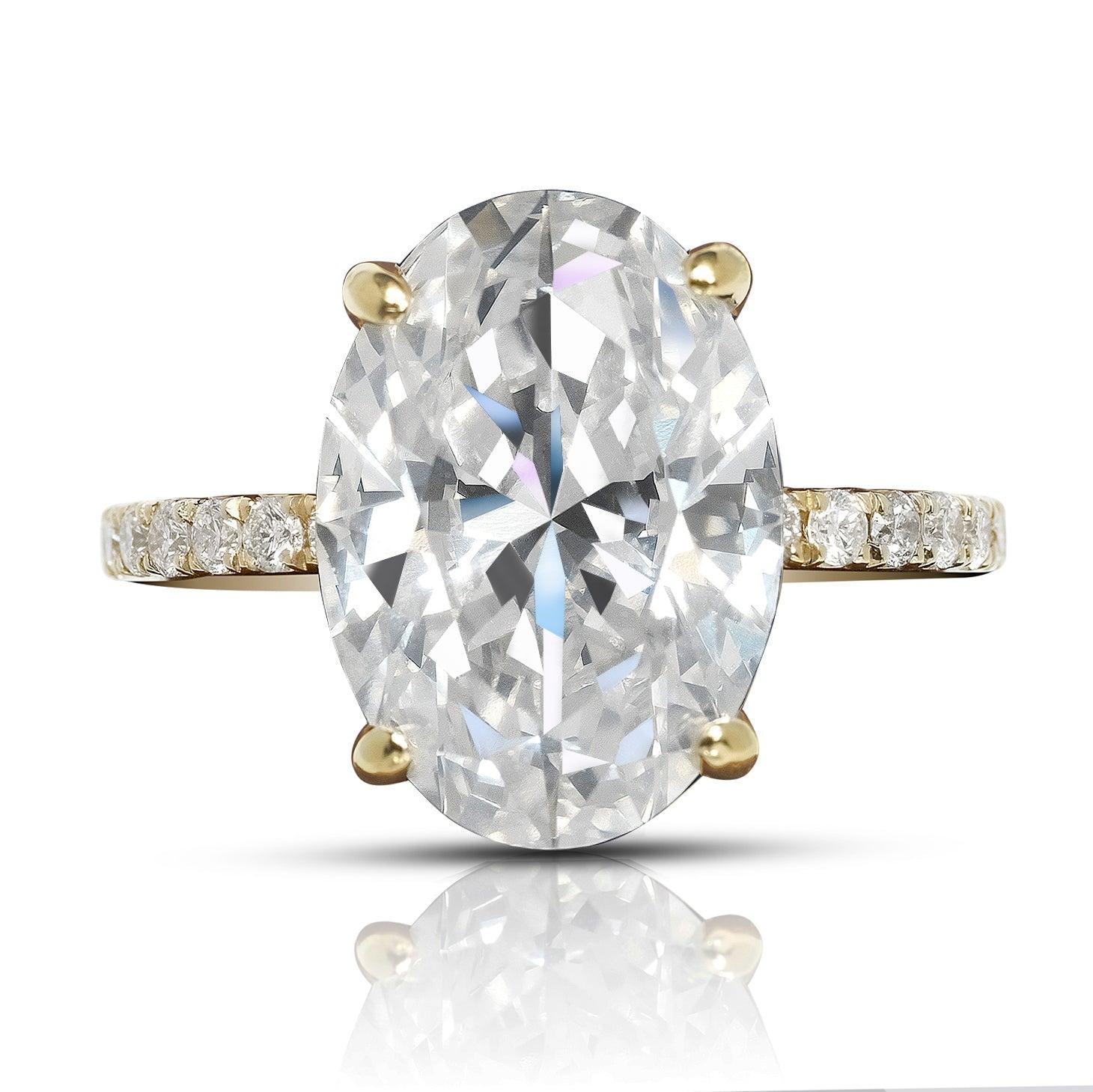 LEAH Oval-Cut Thin Band Diamond Ring BY MIKE NEKTA

GIA CERTIFIED
Center Diamond:
Carat Weight: 5 Carat
Color: F*
Clarity: VS2
Style: OVAL
Approximate Measurement: 13.6 x 9.6 x 5.7 mm
* This diamond has been treated by one or more processes to
