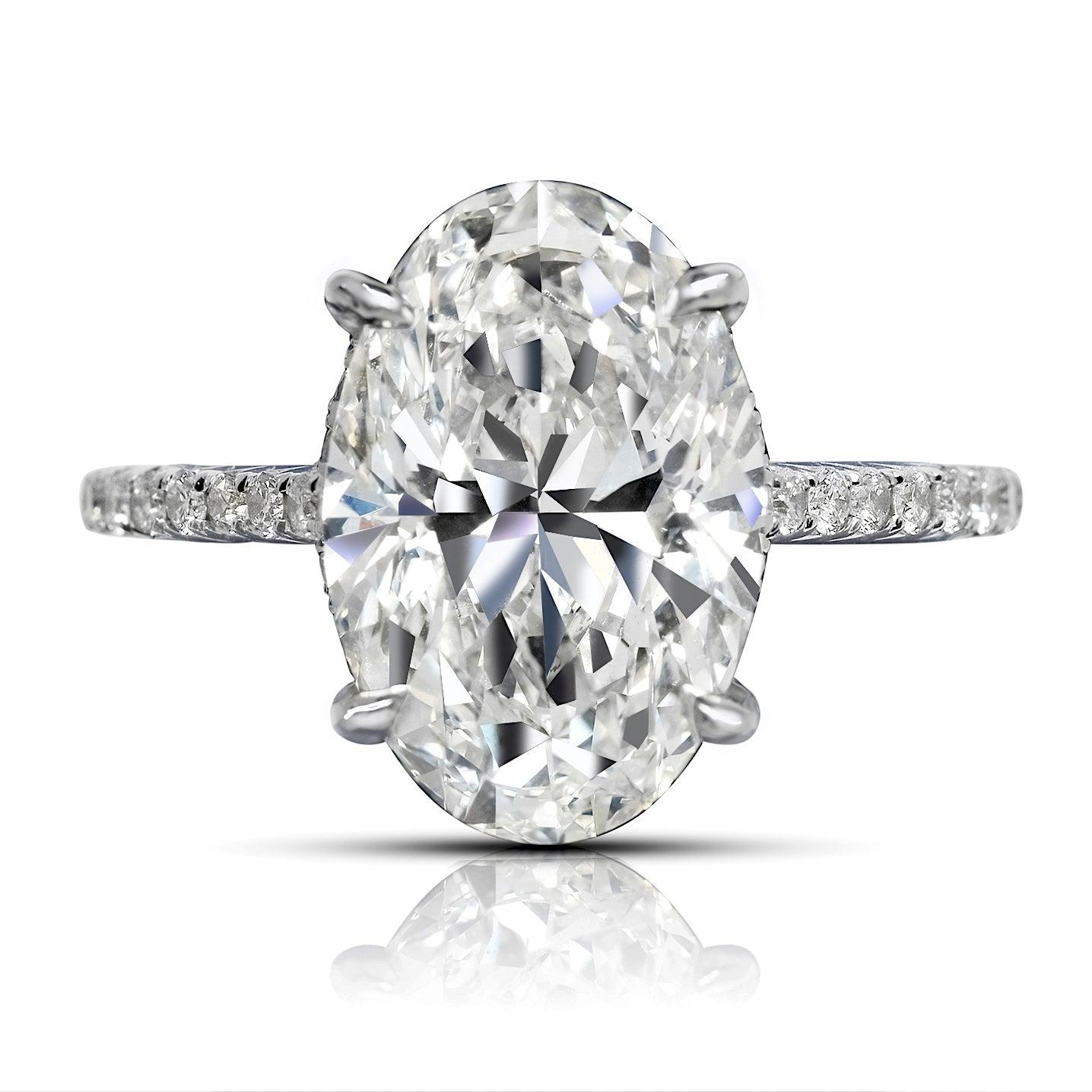 DIANA DIAMOND ENGAGEMENT RING in 18K WHITE GOLD BY MIKE NEKTA
GIA CERTIFIED  

Center Diamond:
Carat Weight: 5 Carats
Color: H
Clarity: VS2
Style:  OVAL BRILLIANT
Approximate Measurements: ﻿ 13.7 x 9.1 x 5.8 mm

Ring:
Metal: 18K WHITE GOLD
Style: 4