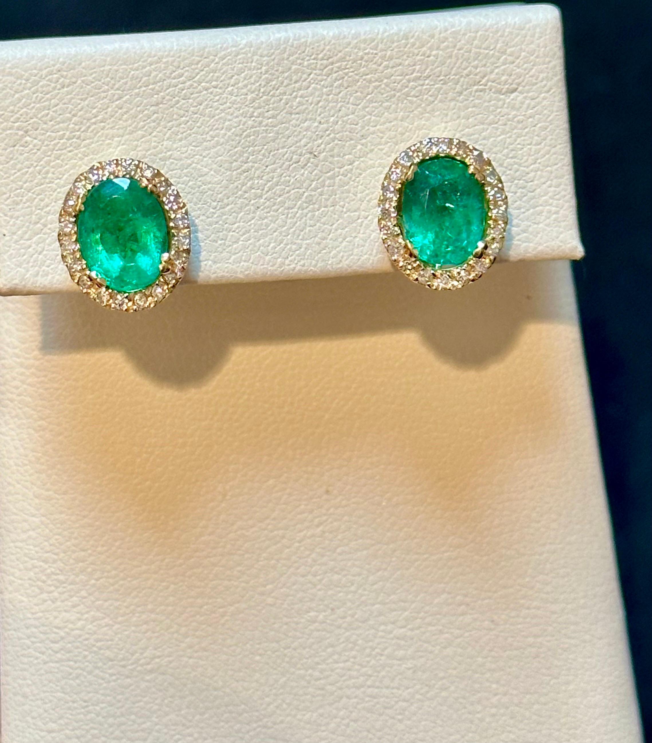 6 Carat Oval Shape Emerald and Diamond Post Back Earrings 14 Karat Yellow Gold For Sale 2