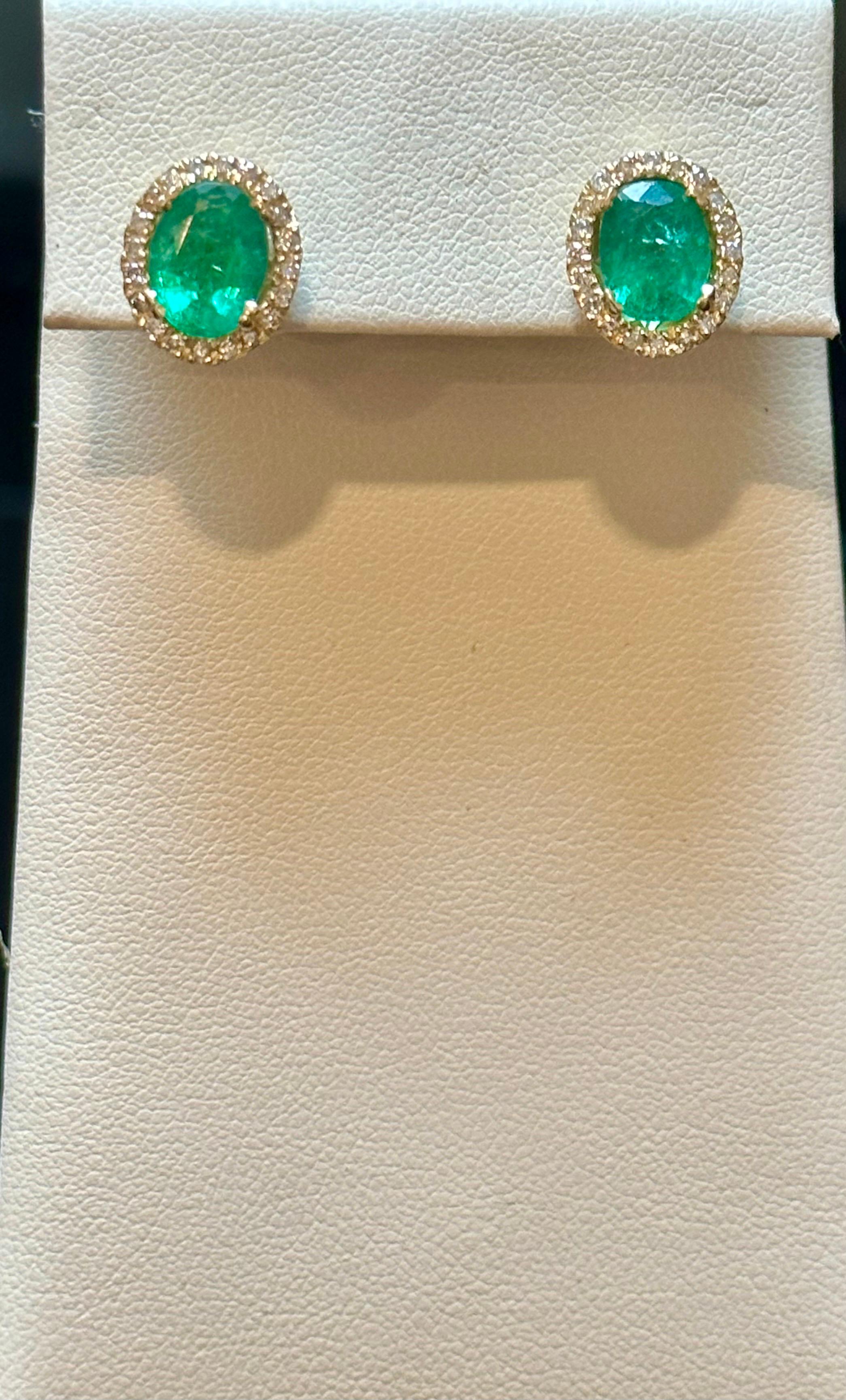 Women's 6 Carat Oval Shape Emerald and Diamond Post Back Earrings 14 Karat Yellow Gold For Sale