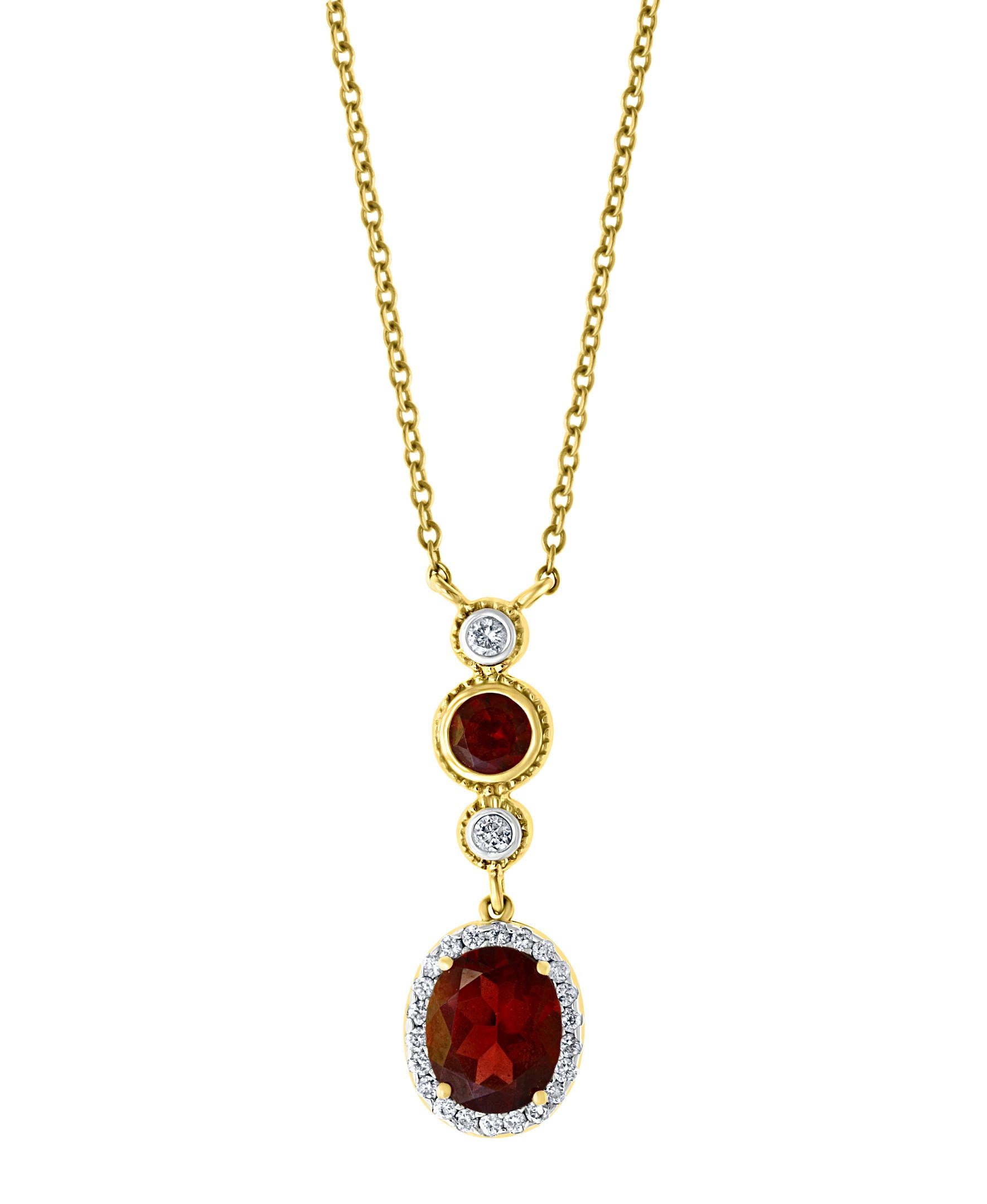 Approximately 6 Carat Oval Shape Garnet & 0.6 Carat Diamond Necklace in 14 Karat Yellow Gold
This Simple yet elegant Necklace  consisting of a Two oval shape Garnet  surrounding by brilliant cut round diamonds with a solid 14 Karat yellow gold