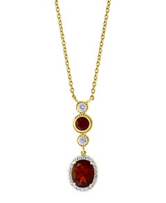 6 Carat Oval Shape Garnet and 0.6 Carat Diamond Necklace in 14 Karat Yellow Gold